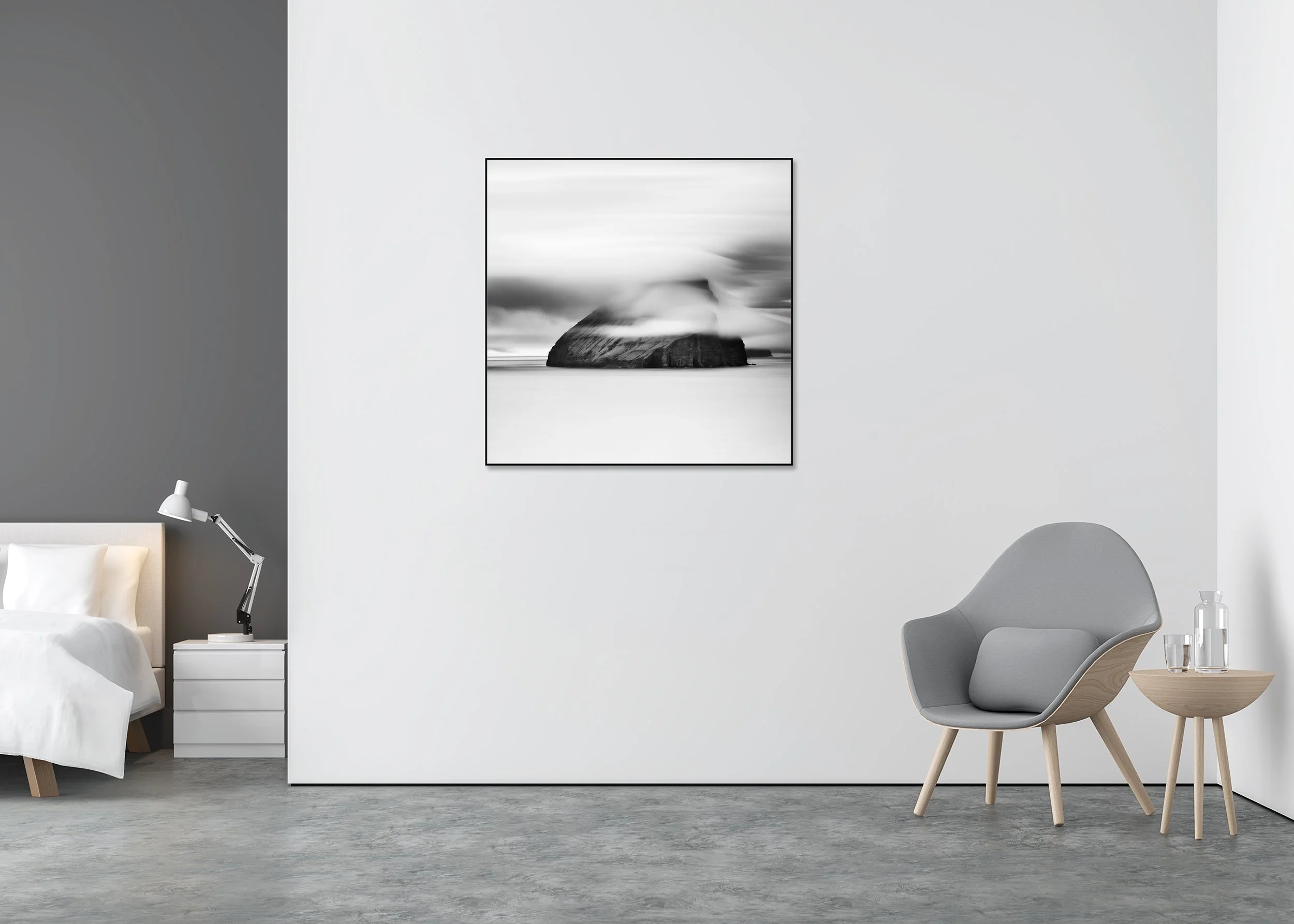 Fine art black and white landscape print of a dramatic sea rock island beneath flowing cloud, mounted to Dibond in an aluminium ArtBox