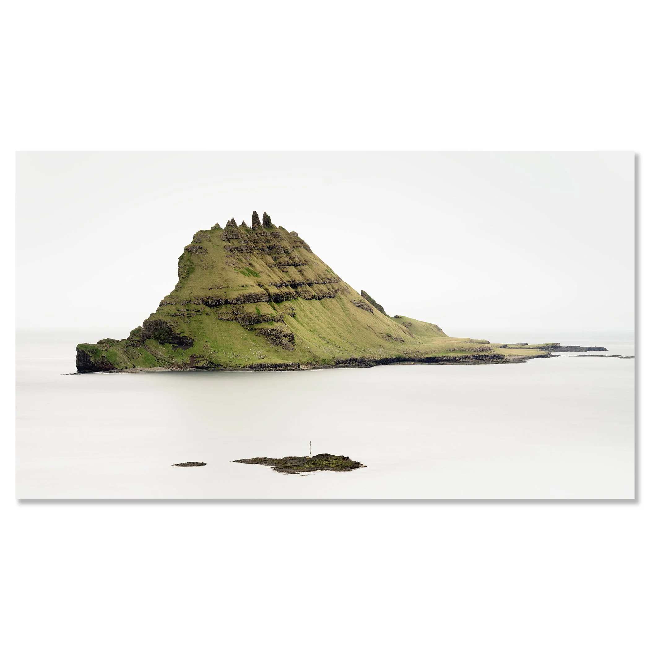 Gerald Berghammer - Color seascape Photography. A green, rocky island with steep, layered slopes rising from calm waters and an island lighthouse. Chromaluxe frameless
