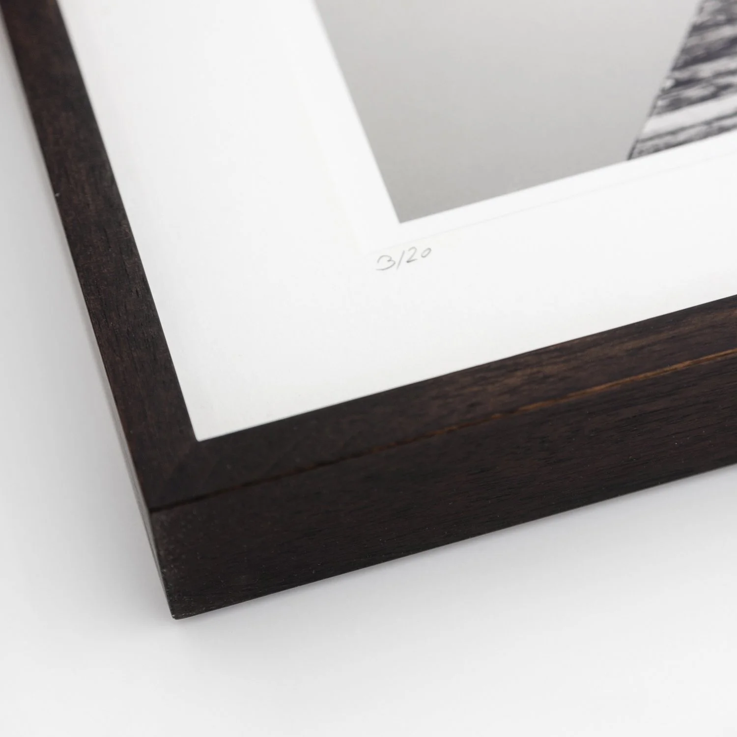 Close-up of edition number 3/20 and dark-brown wooden frame of Self Portrait Study 2 by Gerald Berghammer
