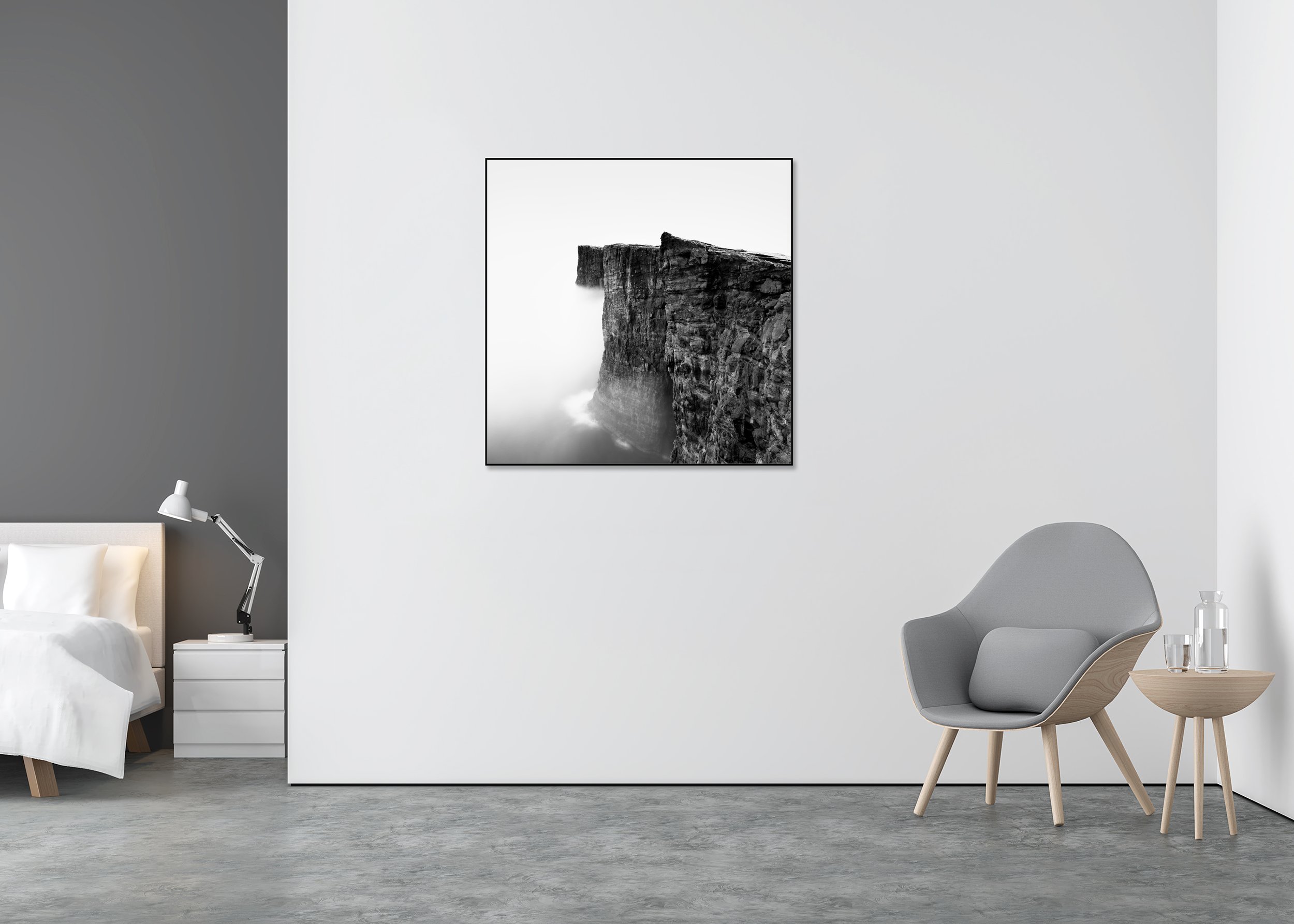 Black-and-white photo print of steep coastal cliffs above the ocean, with rugged rock textures fading into sea mist, mounted to Dibond in an aluminium ArtBox.
