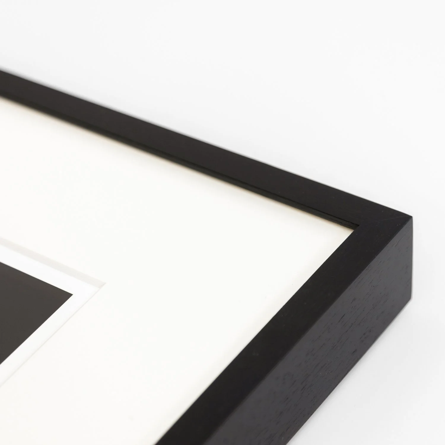 Detail of the handmade black wooden frame and natural-white archival mount of Antelope Canyon 6 by Gerald Berghammer.