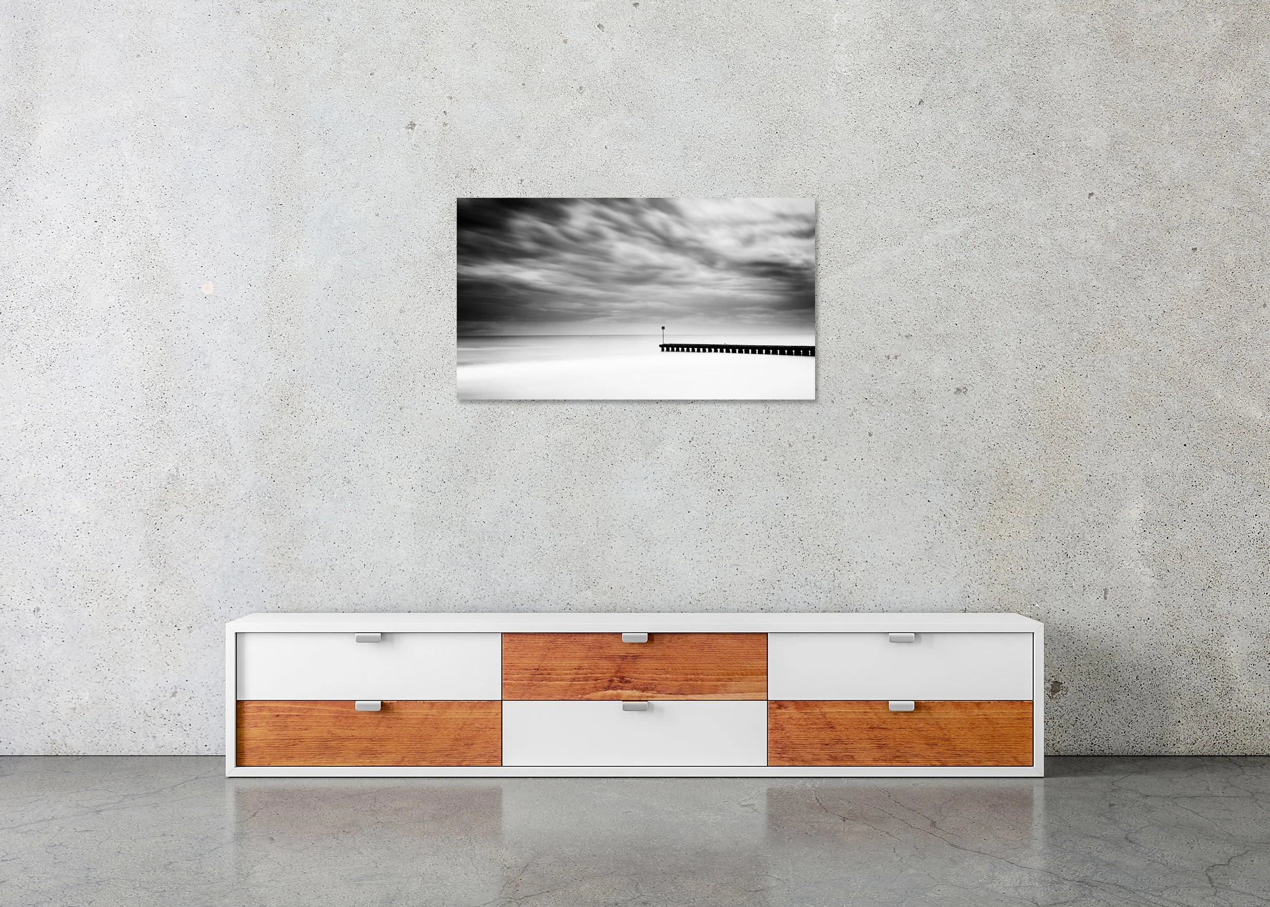 Black and white seascape with dramatic clouds and a wooden pier over calm water, photo print mounted to Dibond, frameless.