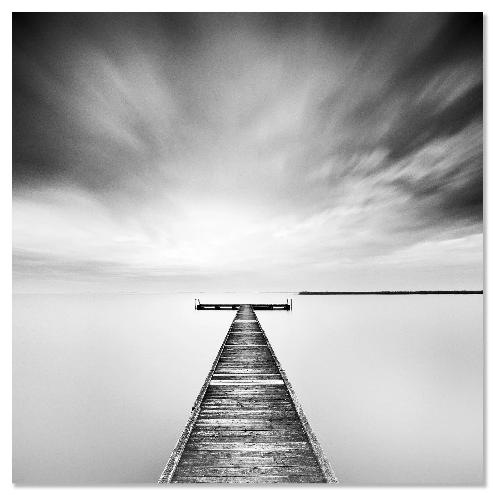 Minimalist black and white landscape photograph of a quiet pier extending into peaceful water – dibond frameless