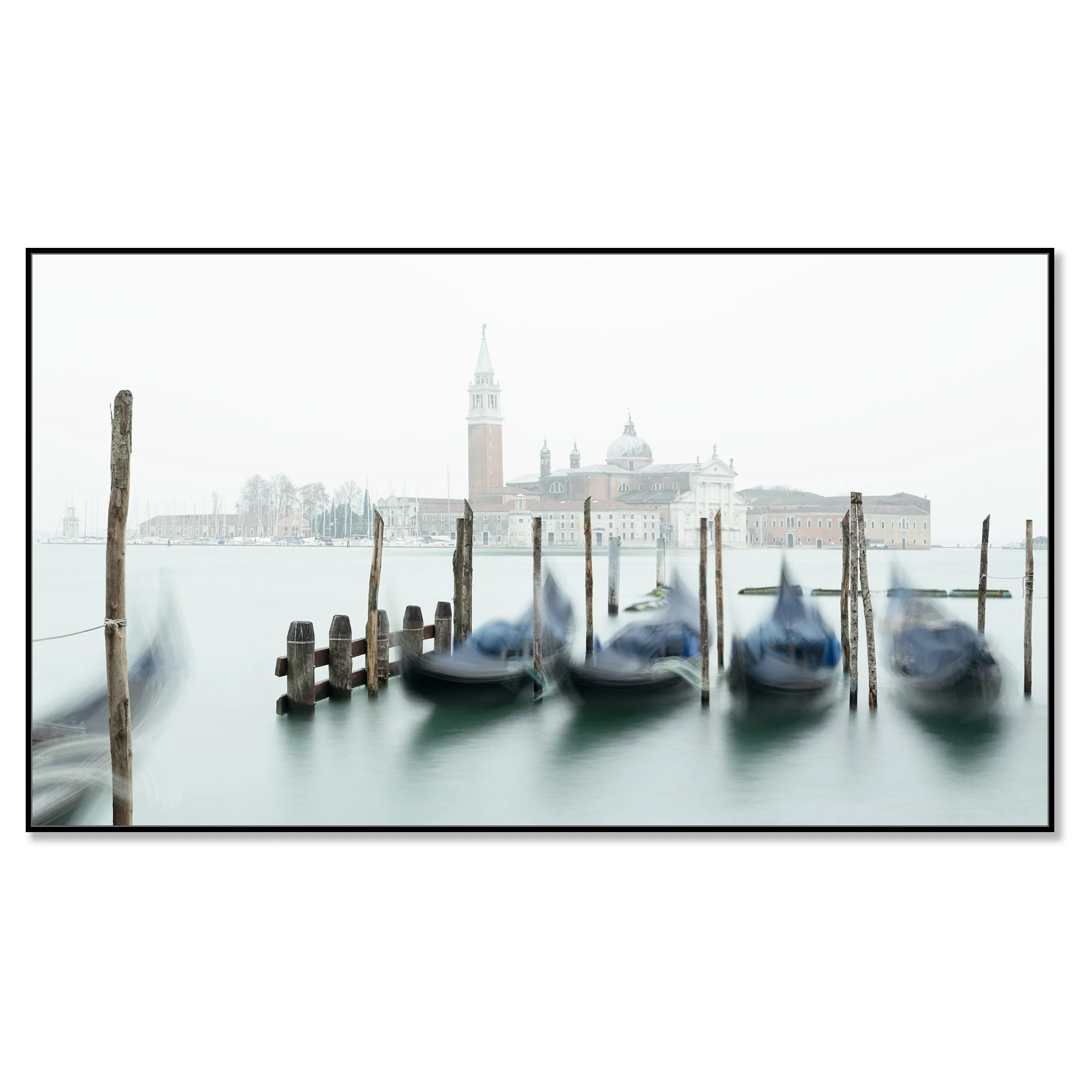 Gerald Berghammer - Color cityscape photography. Gondolas docked along wooden posts on a misty water canal and in back San Giorgio Maggiore Church. Chromaluxe framed black