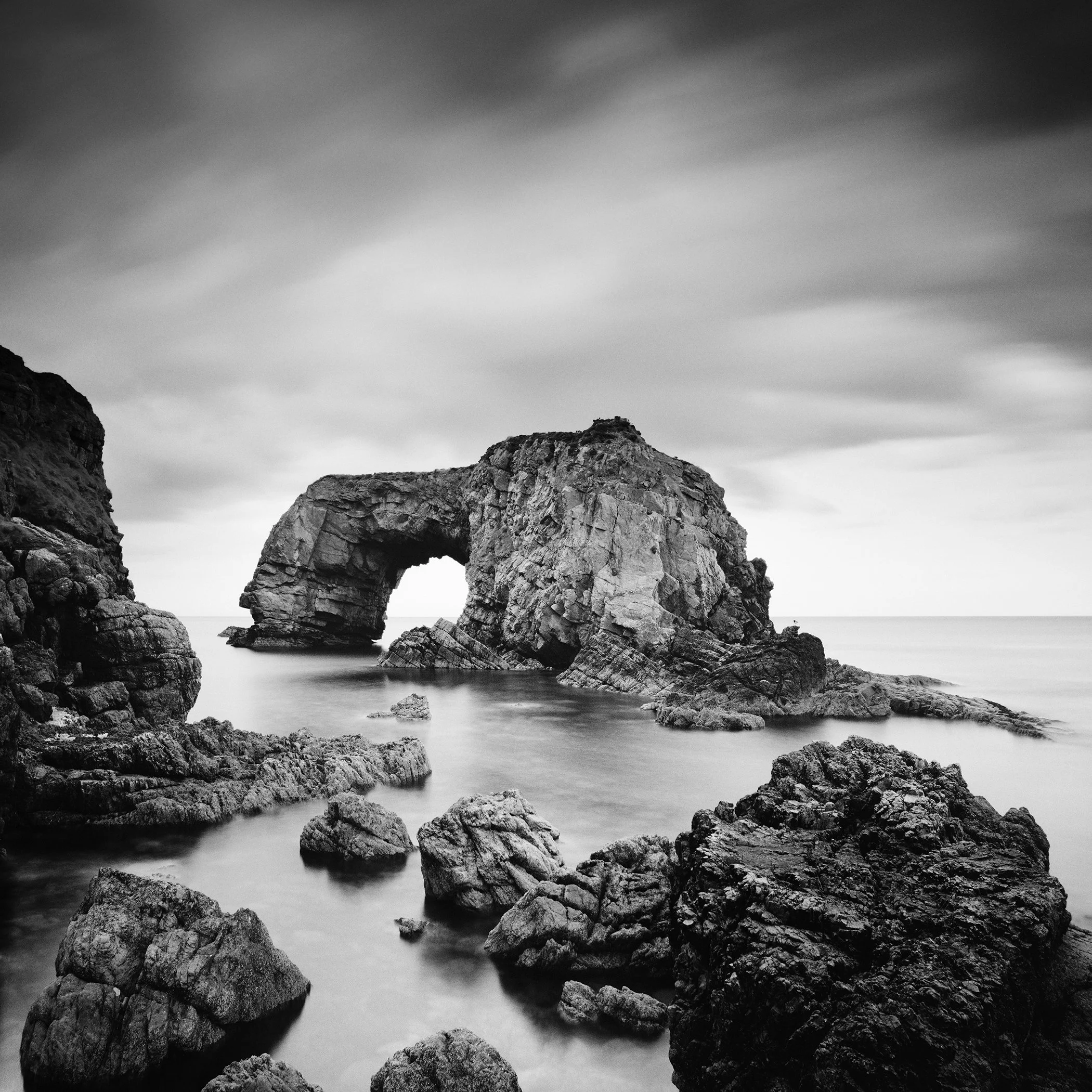 Long-exposure black-and-white seascape of Great Pollet Sea Arch, Fanad, Ireland, by Gerald Berghammer