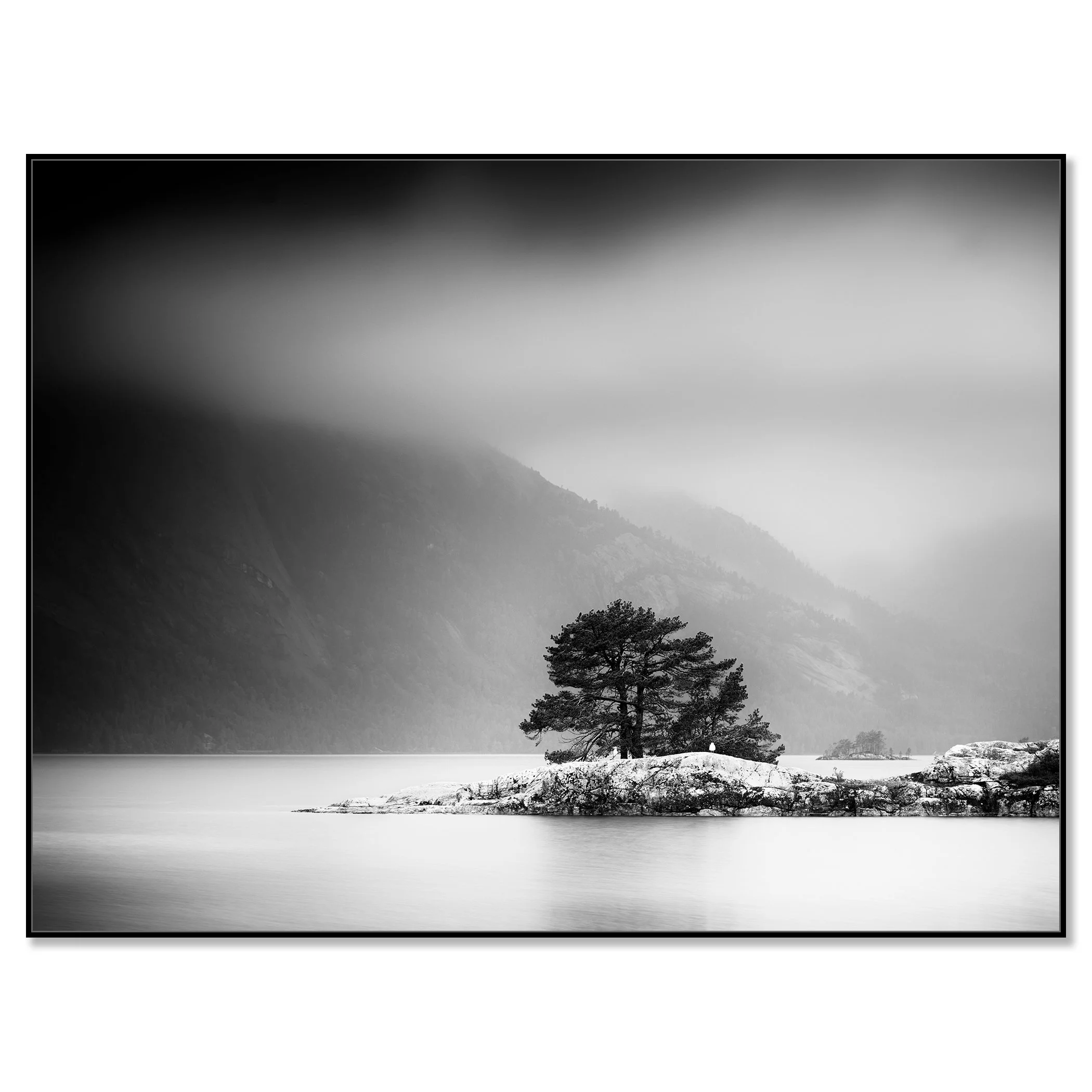 Black and white fine art photograph of a lone pine tree on a small island in a misty mountain lake – framed ArtBox black