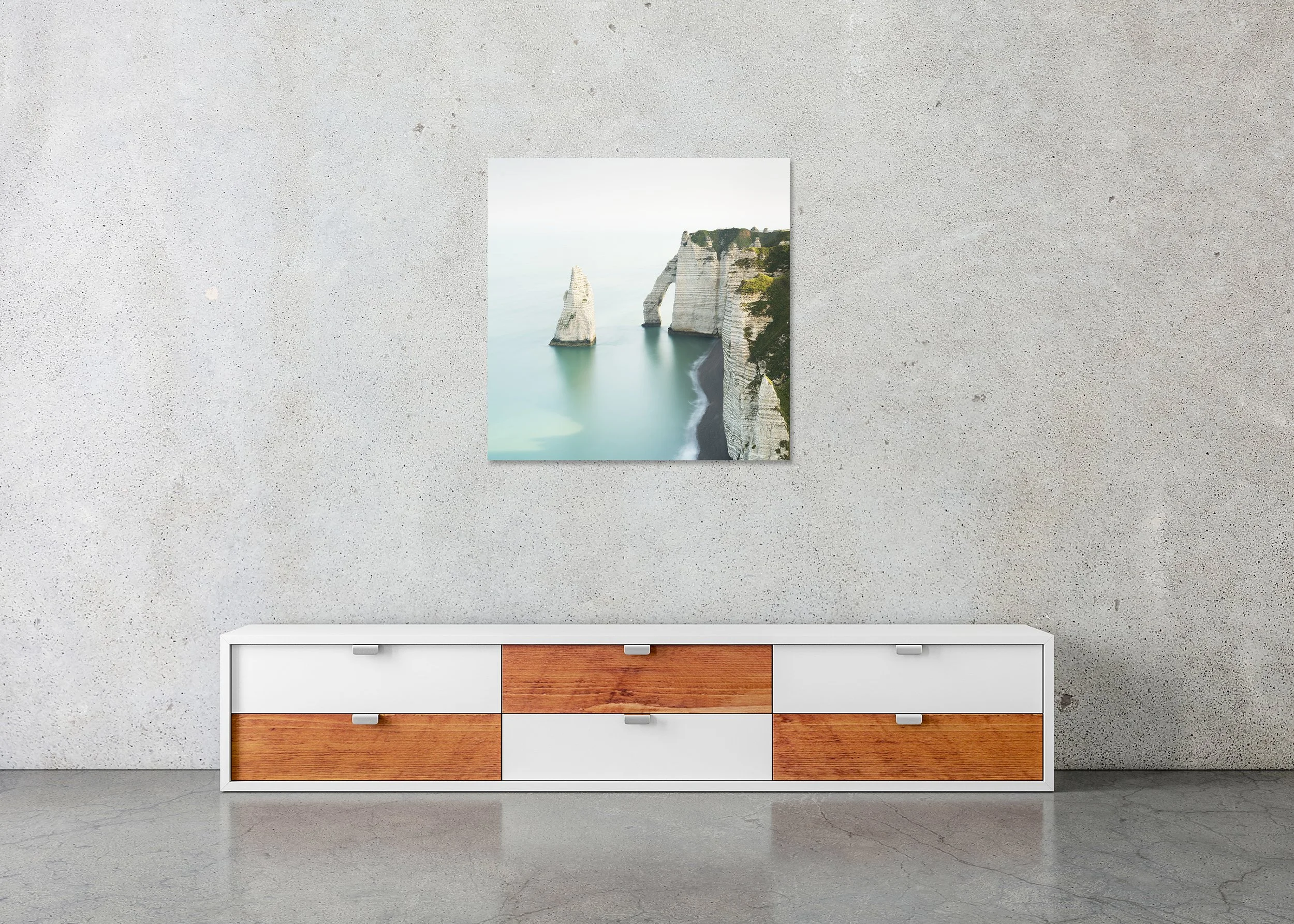 Frameless Dibond-mounted White Cliffs of Étretat print shown above a modern sideboard