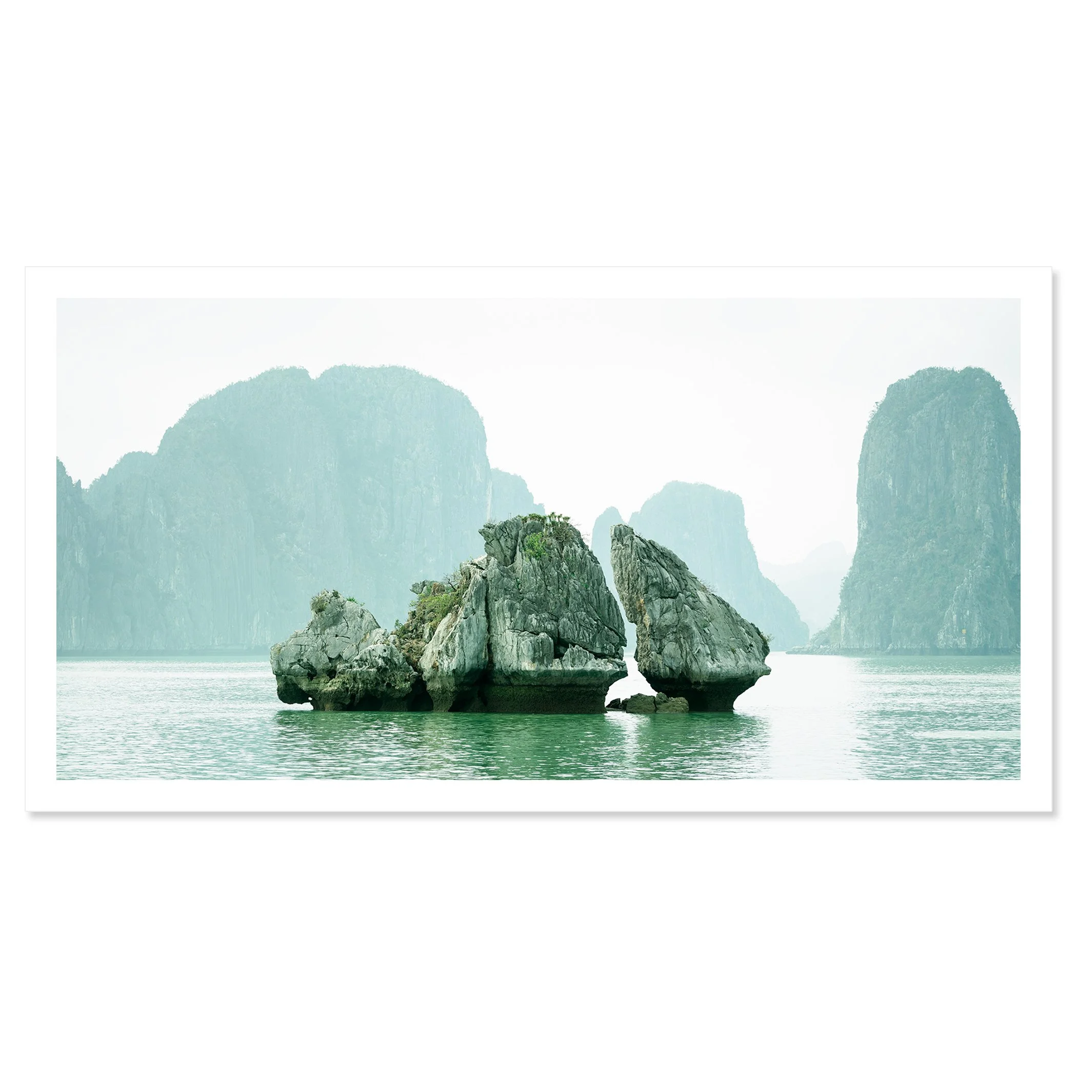 Gerald Berghammer - Color seascape photography. Large rocks rising from the water with, surrounded by calm water and distant limestone cliffs and islands. Fine art print only