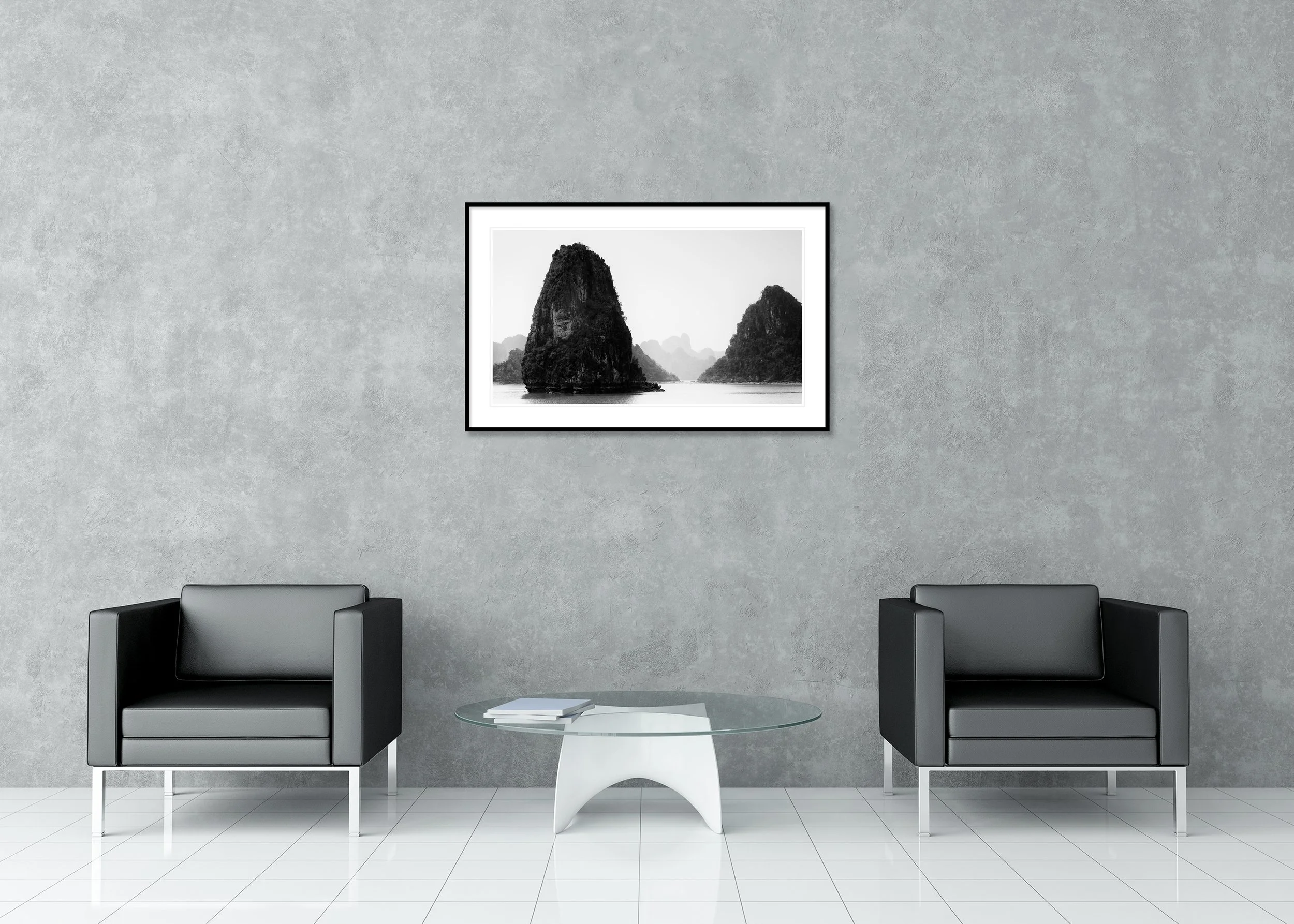 Black-and-white archival pigment print of misty limestone karsts in Ha Long Bay, Vietnam, in a classic frame with a mount.