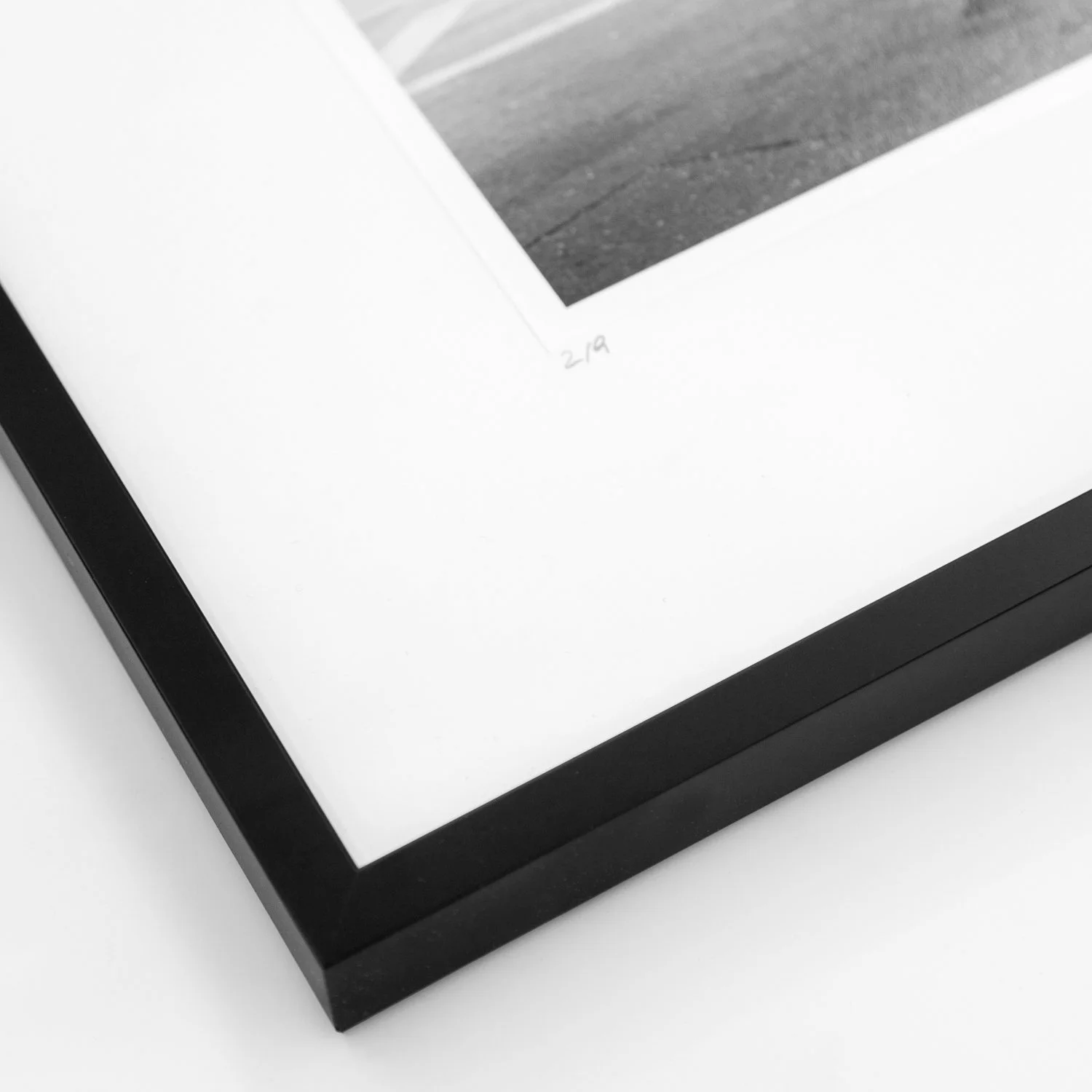 Detail of the black wooden frame and handwritten 2022 inscription on Caffè Florian by Gerald Berghammer.