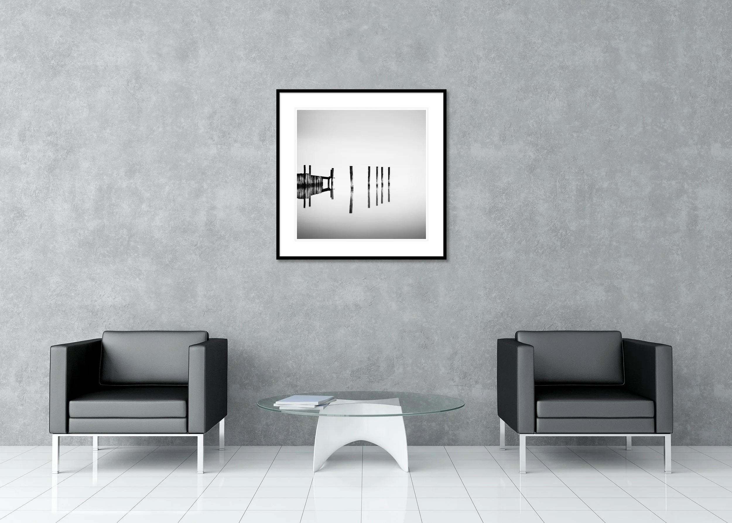 Abstract black and white photograph of wooden pier posts reflected in calm water. Archival Pigment Print – Classic Frame with Passe-Partout