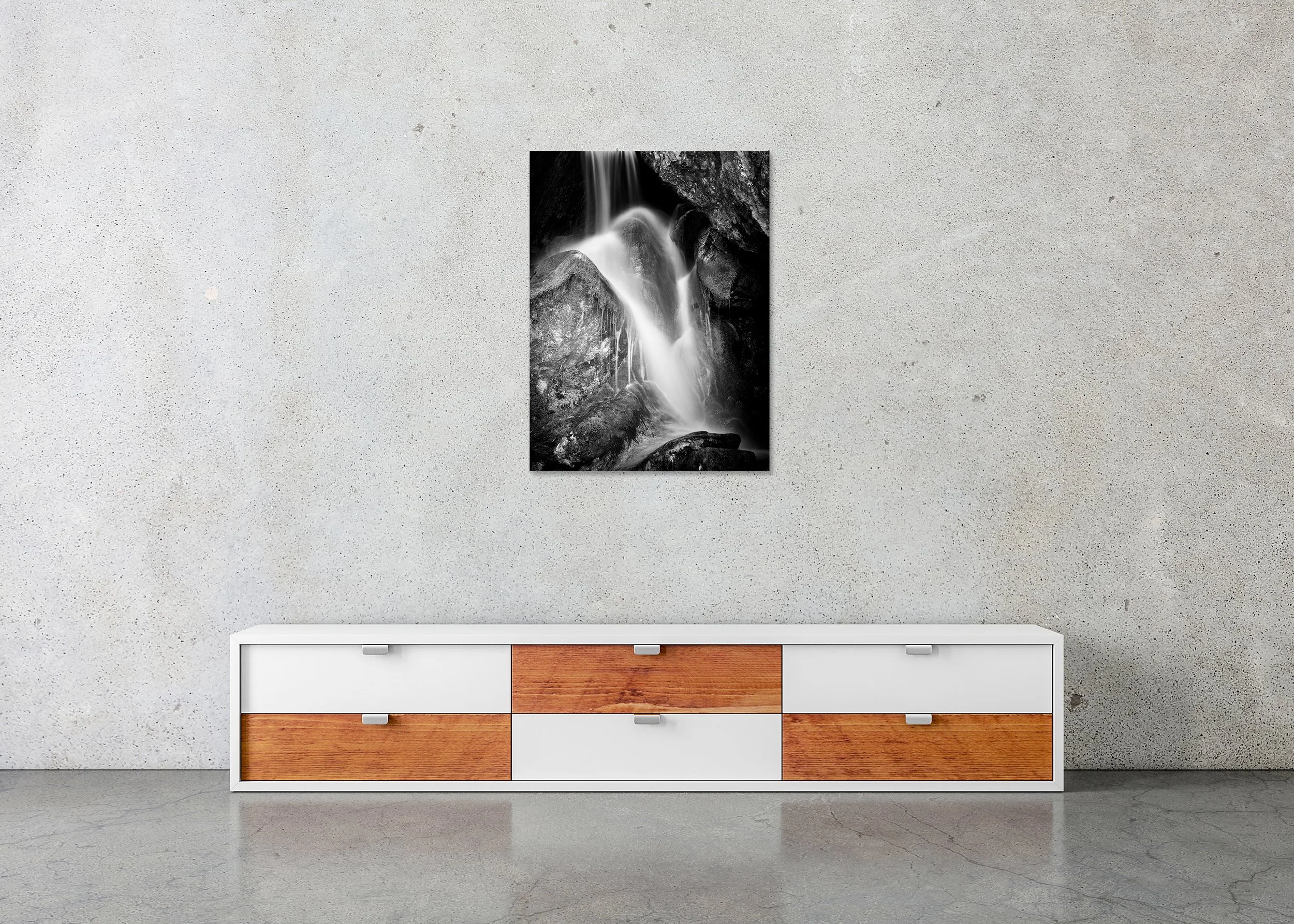 Waterfall Detail Study 1 – Austria, frameless black-and-white photograph on aluminium displayed above a low cabinet.