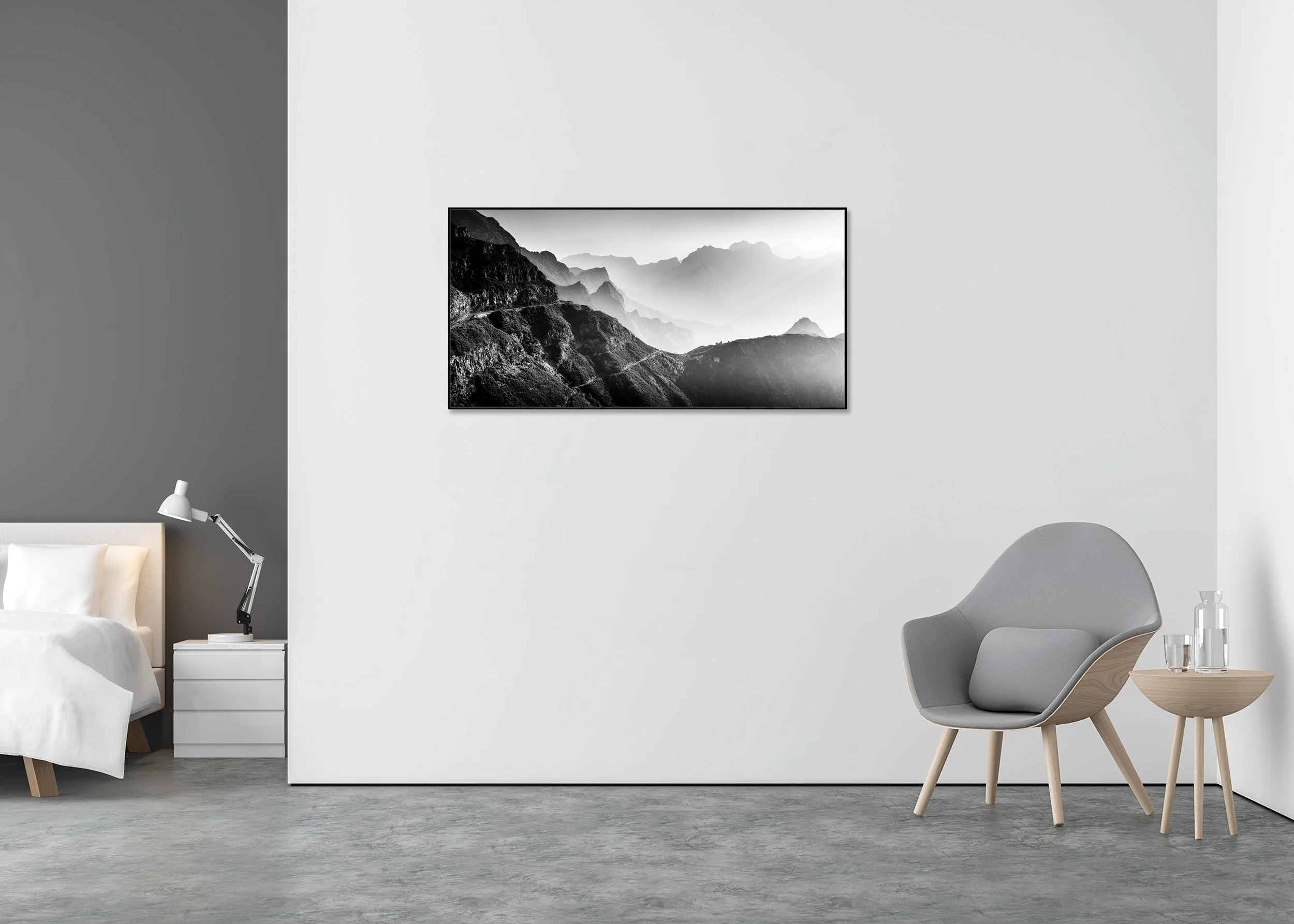 Black and white photo print of layered mountain ranges with foggy valleys and a narrow winding road, mounted to Dibond in an aluminium ArtBox frame.