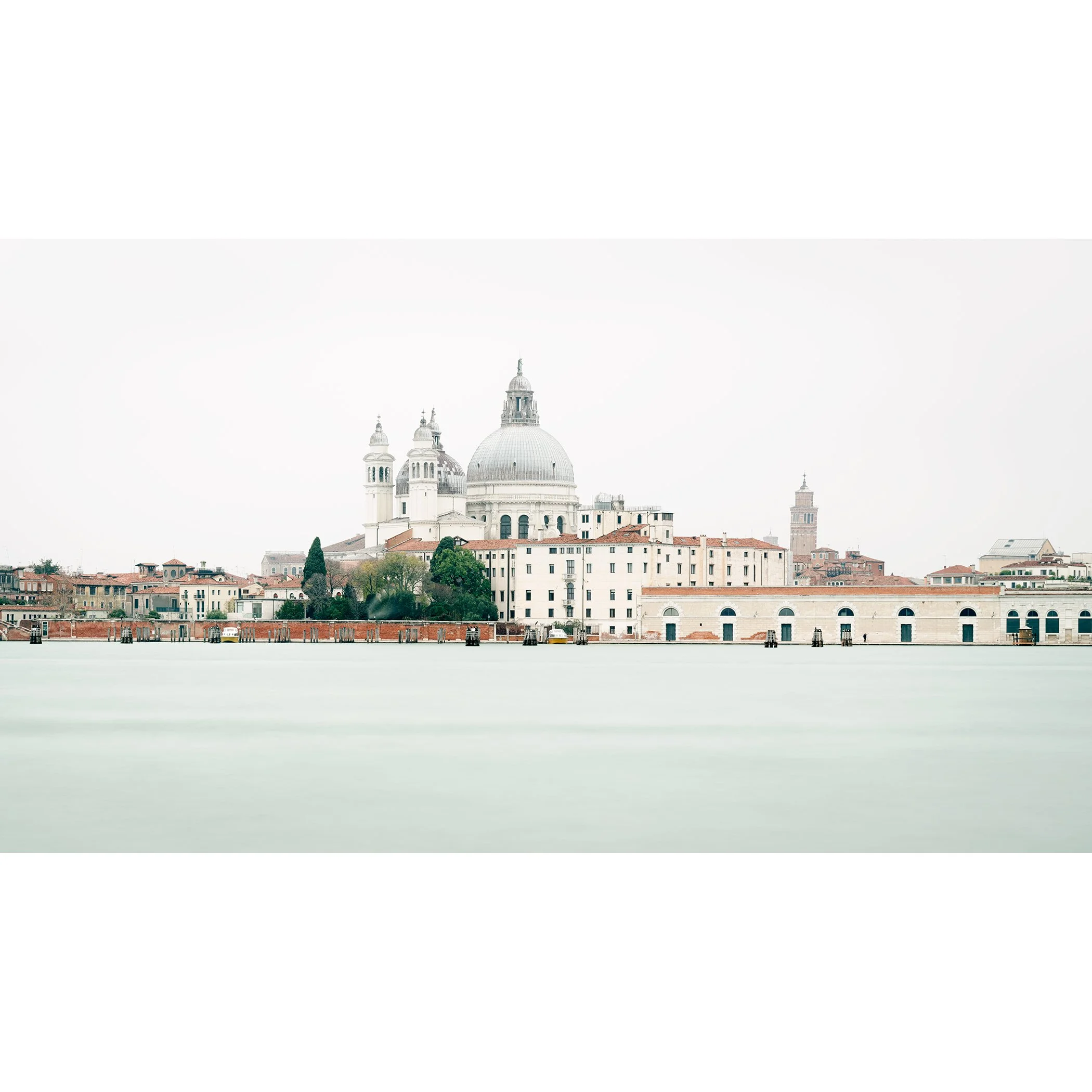 Gerald Berghammer - Color cityscape photography. View of a city skyline with the Basilica di Santa Maria della Salute in Venice, Italy, on a foggy day.