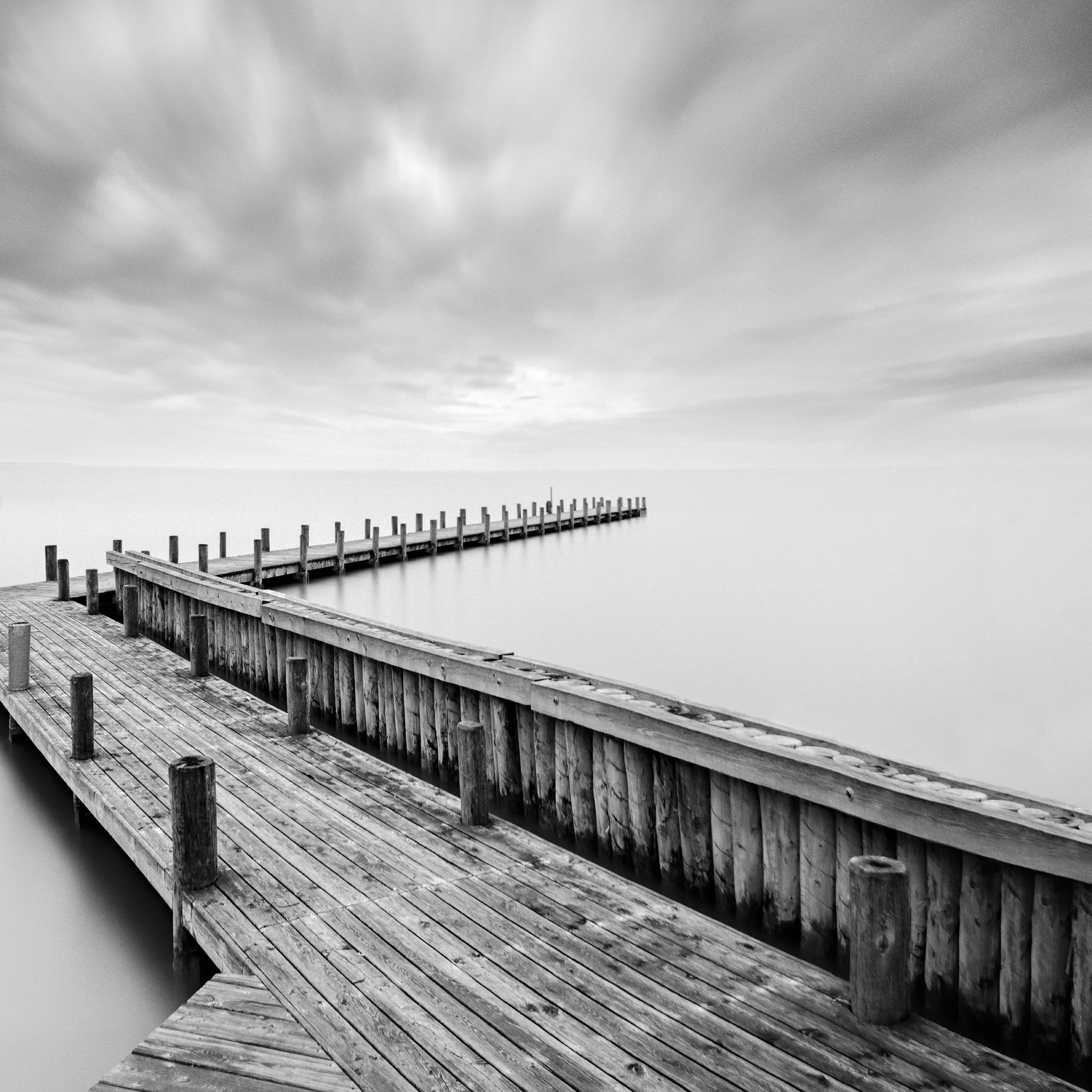 Cropped view of Wood Pier Study 1 by Gerald Berghammer, analogue black-and-white waterscape of Lake Neusiedl.