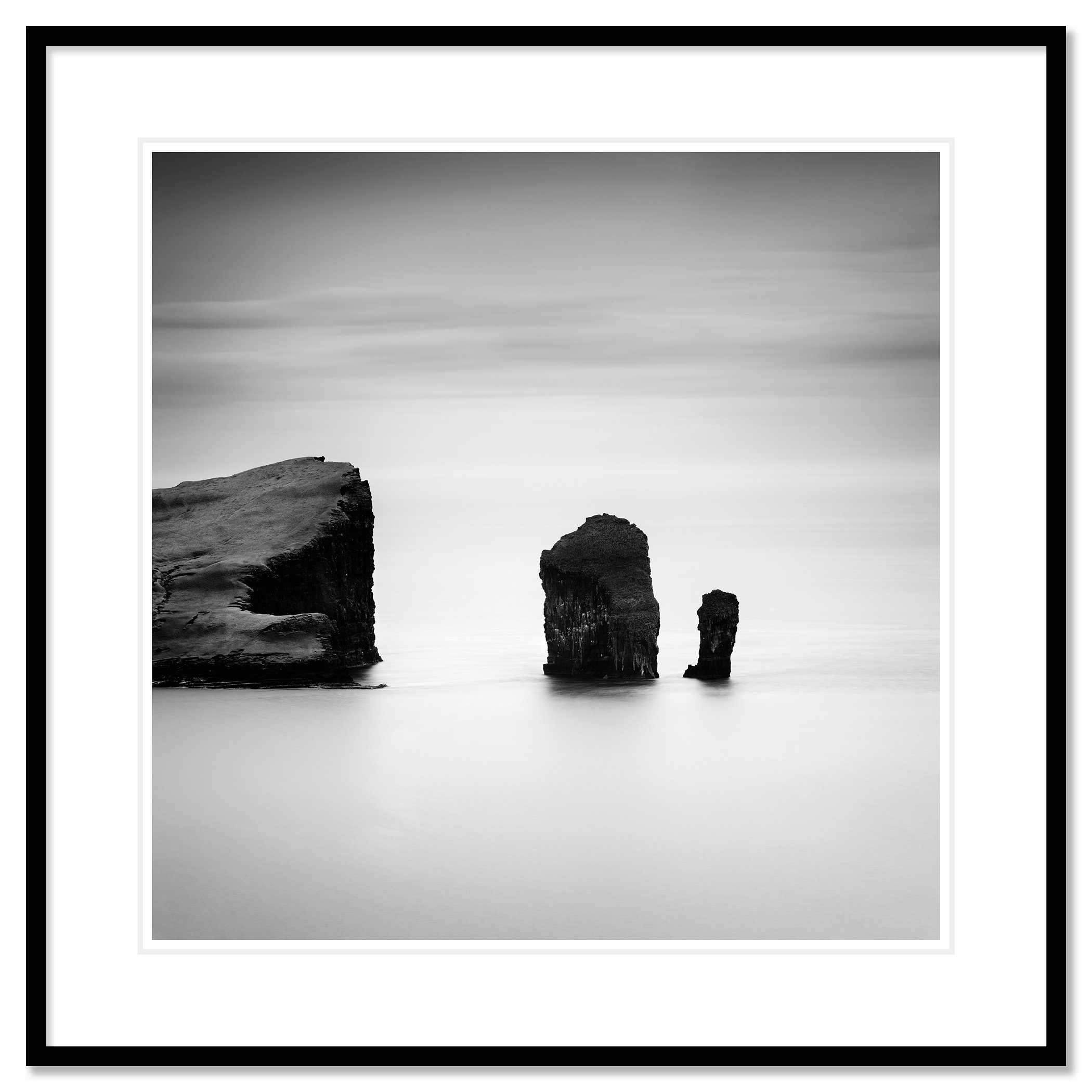 North Atlantic Basalt Study 1 – Faroe Islands, black-and-white fine art print in a black aluminium frame with a white mount by Gerald Berghammer.