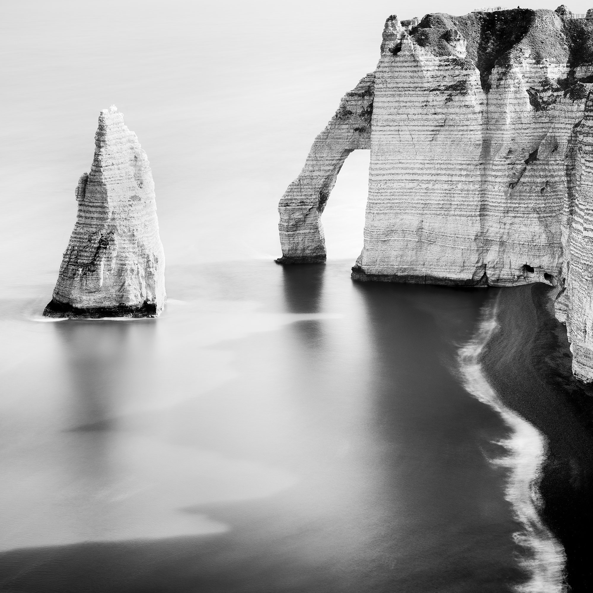 Cropped detail of The Cliffs of Étretat, Study 3, showing the limestone cliffs and smooth long-exposure sea. Photo by Gerald Berghammer.