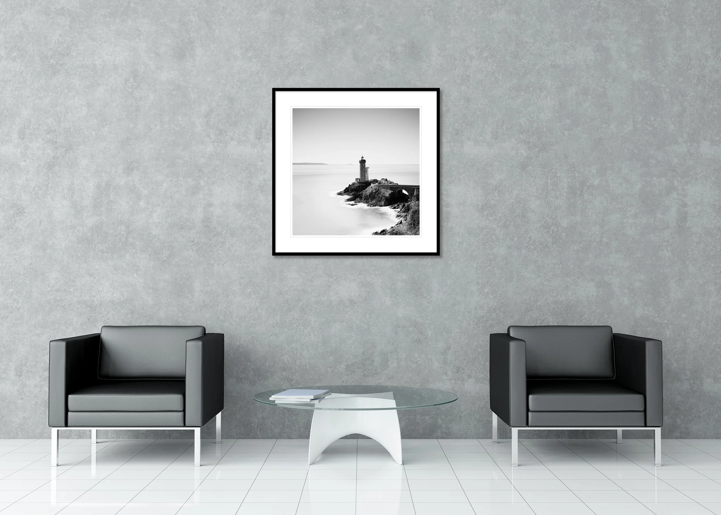 Phare du Petit Minou lighthouse in black and white above a calm sea and rugged coastal rocks, archival pigment print in a classic frame with mount