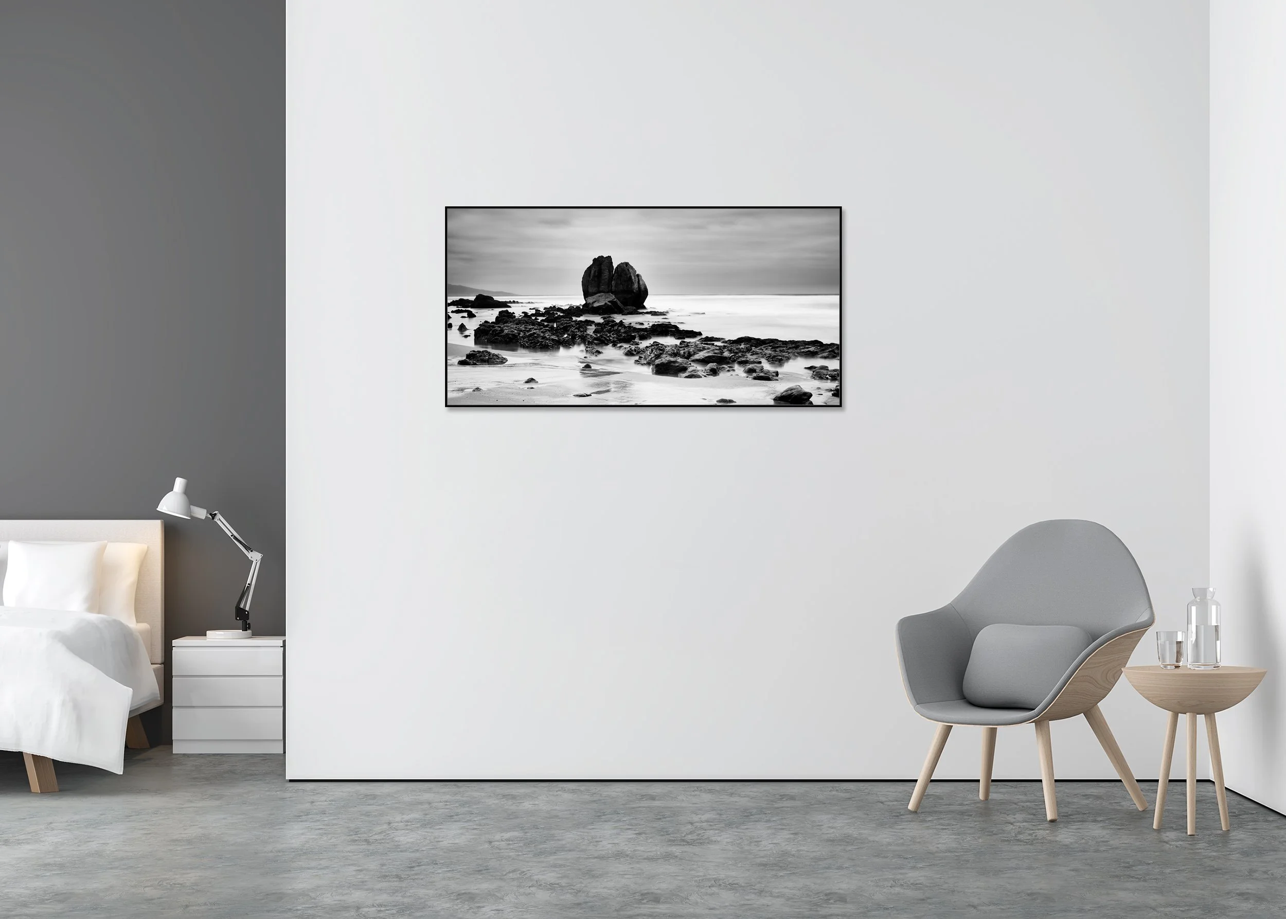 Black and white long-exposure photo print of a rocky beach and sea under a cloudy sky, mounted to Dibond in an aluminium ArtBox