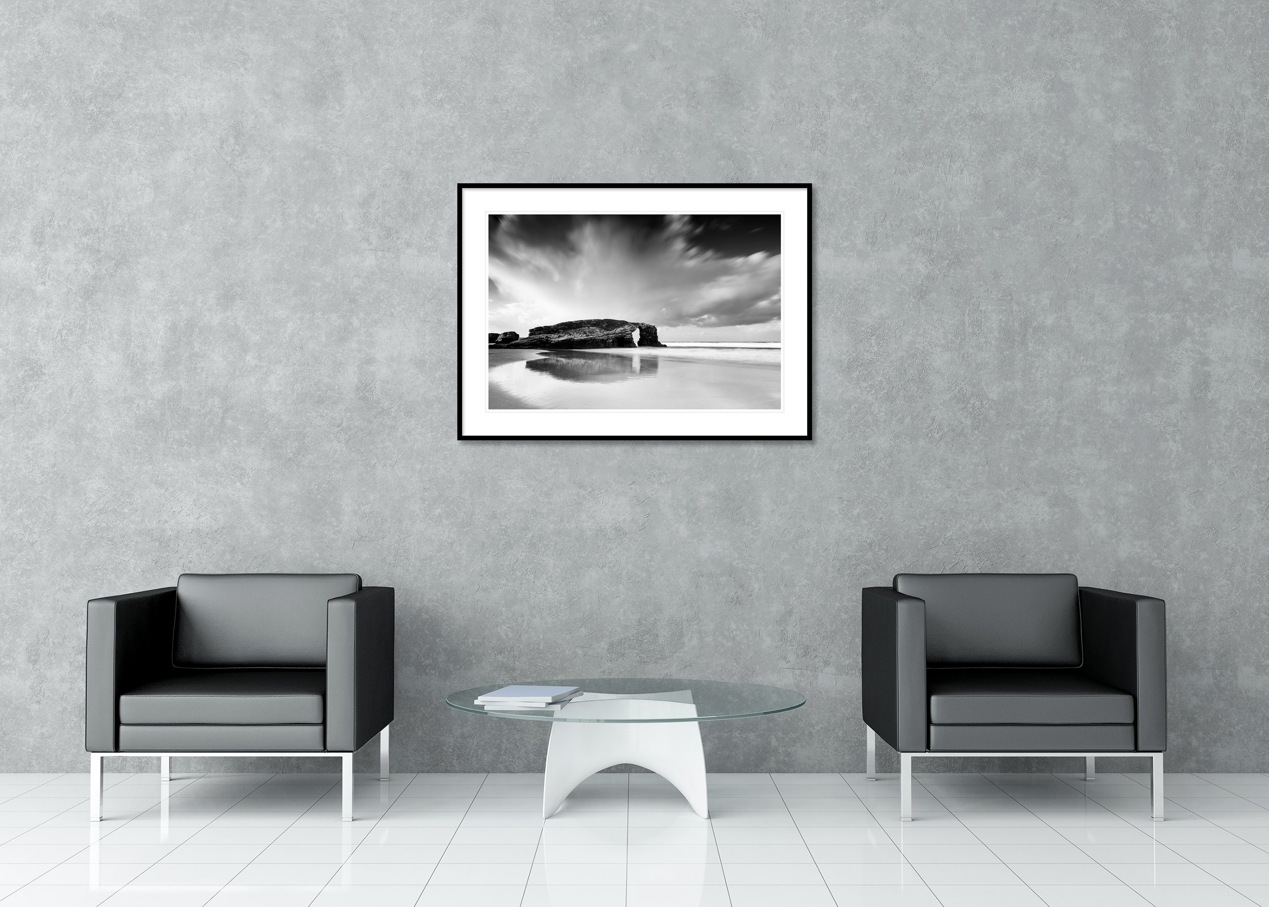 Minimalist black-and-white seascape of As Catedrais Beach, Spain, with rock arch and horizon line, archival pigment print in a classic frame with mount.
