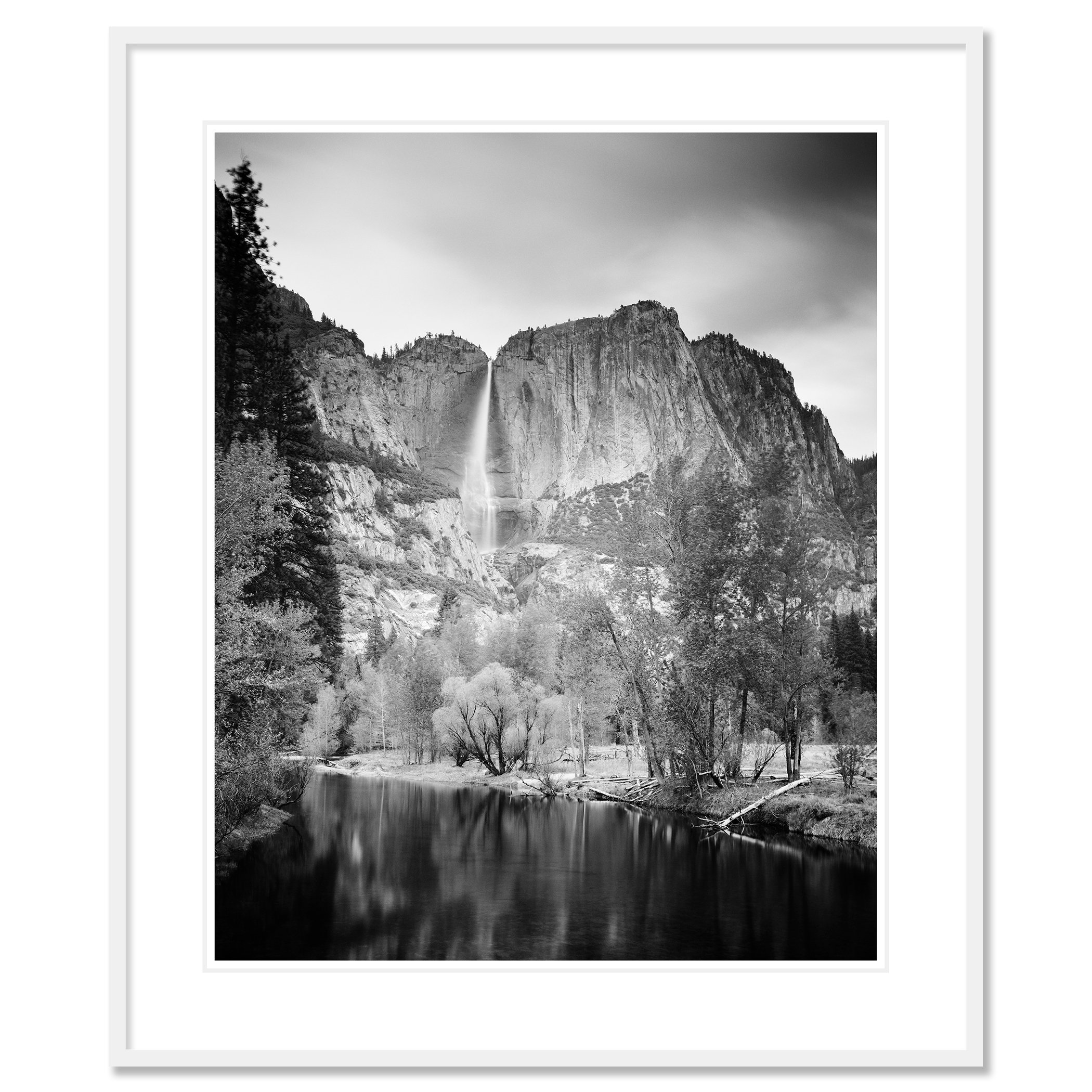 © 2015 Gerald Berghammer - Black and white american landscaspe photography. Mountain landscape with a waterfall, trees, and a calm river in the foreground. Classic framed white