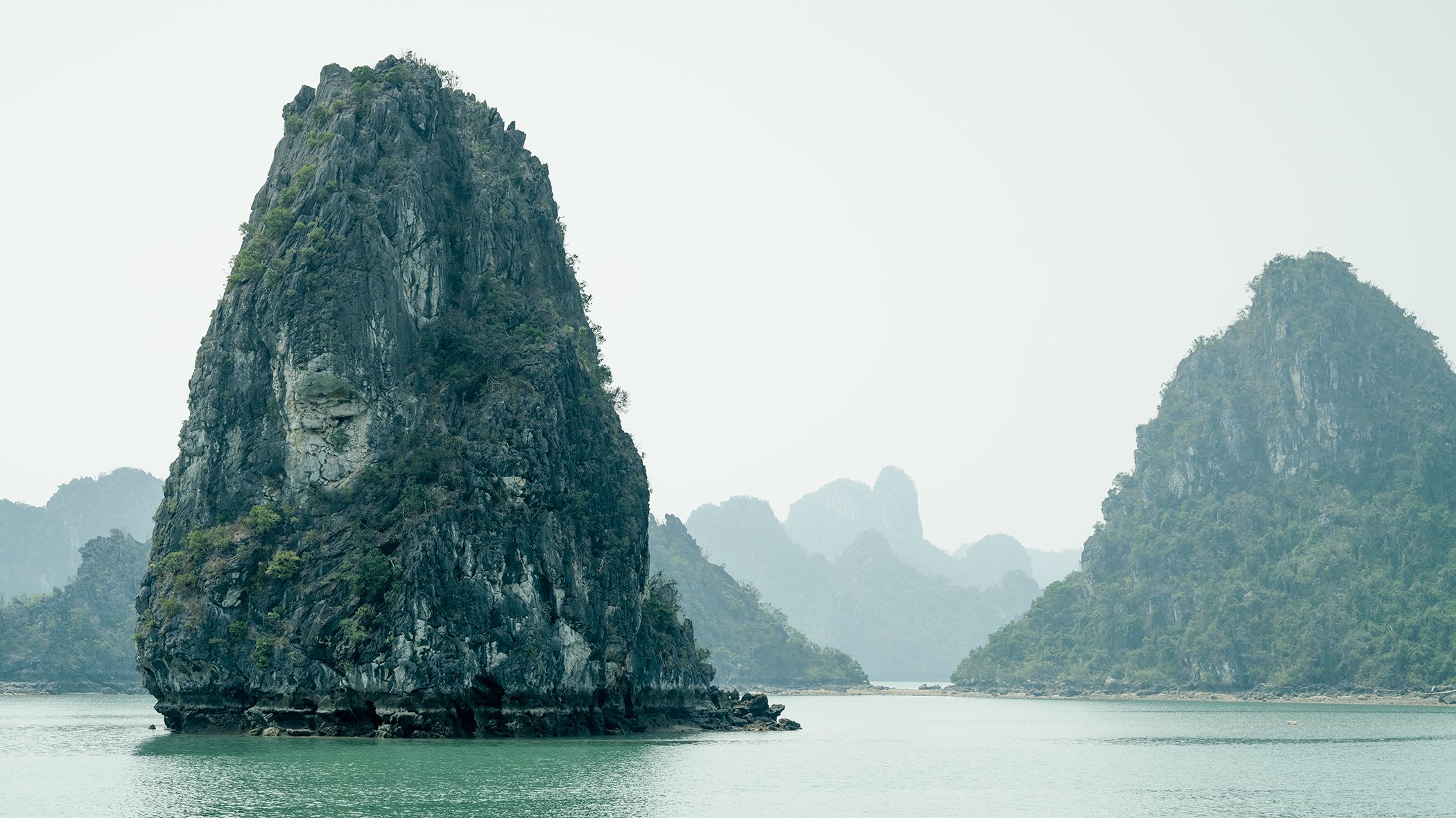 Green Limestone Cliffs Study 1, panoramic colour fine art photograph of limestone karsts in Ha Long Bay, Vietnam, by Gerald Berghammer.