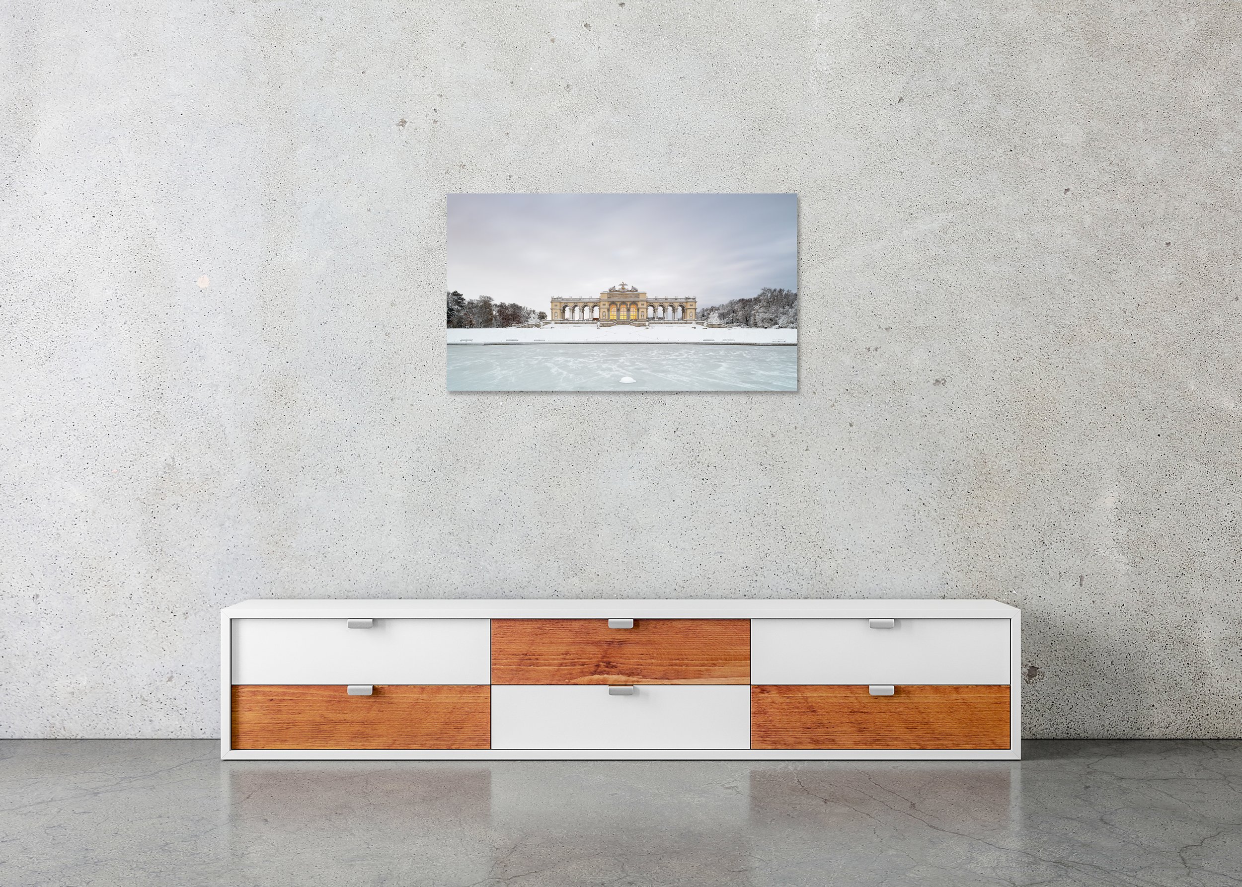 Snow-Covered Gloriette displayed in a modern interior as a frameless colour artwork mounted on aluminium Dibond. Photo by Gerald Berghammer.