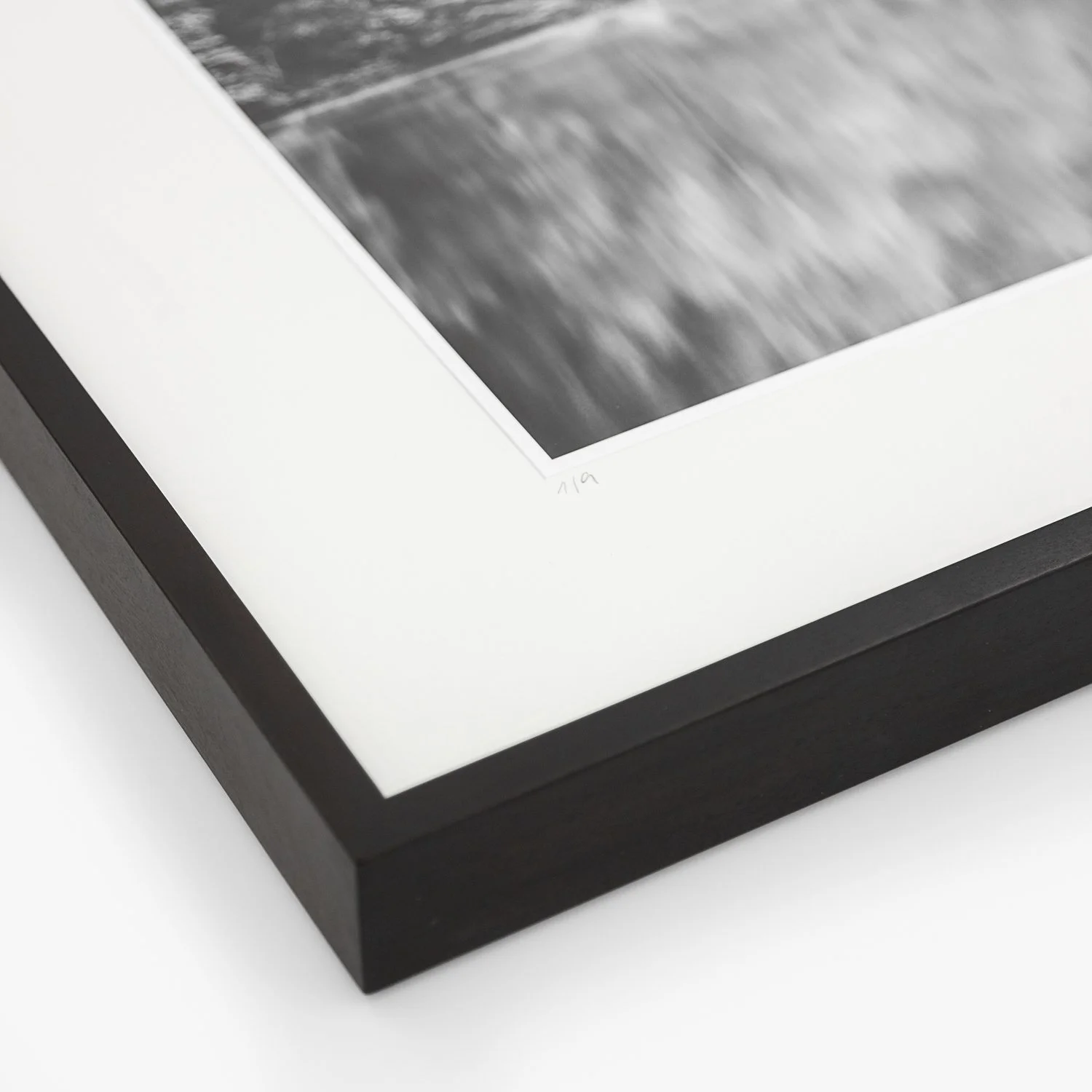 Corner detail of the framed Boat House at Mountain Lake photograph by Gerald Berghammer, highlighting the black wooden frame, archival mount and handwritten edition marking.