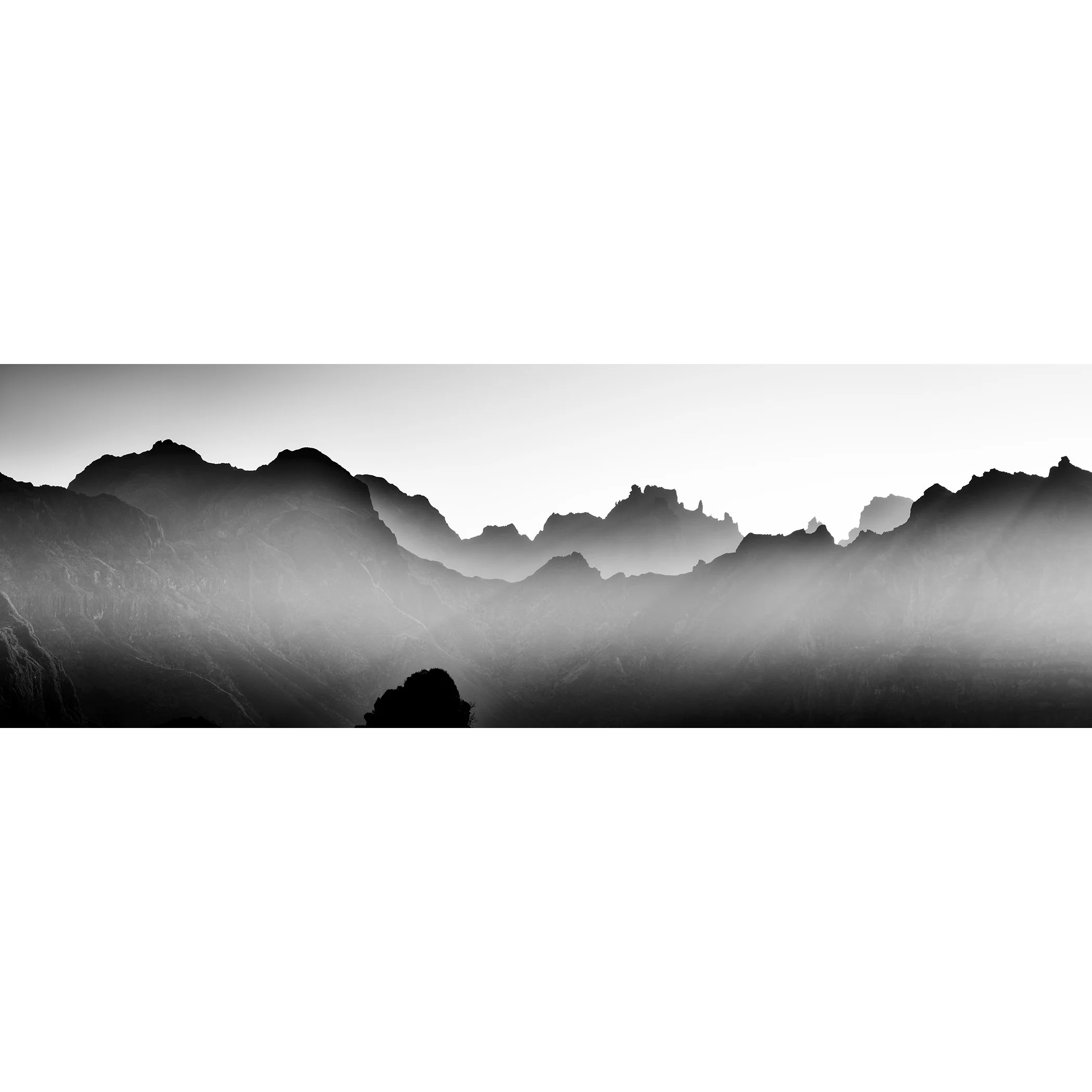 Black-and-white mountain landscape with mist and morning light in Madeira, Portugal, by Gerald Berghammer.
