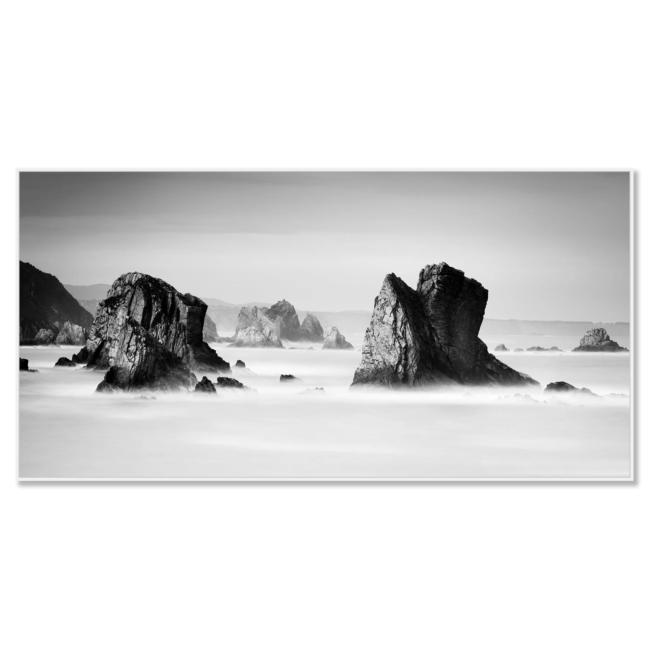 Black-and-white photo of rocky sea stacks and misty ocean waves on a rugged coast – framed ArtBox white