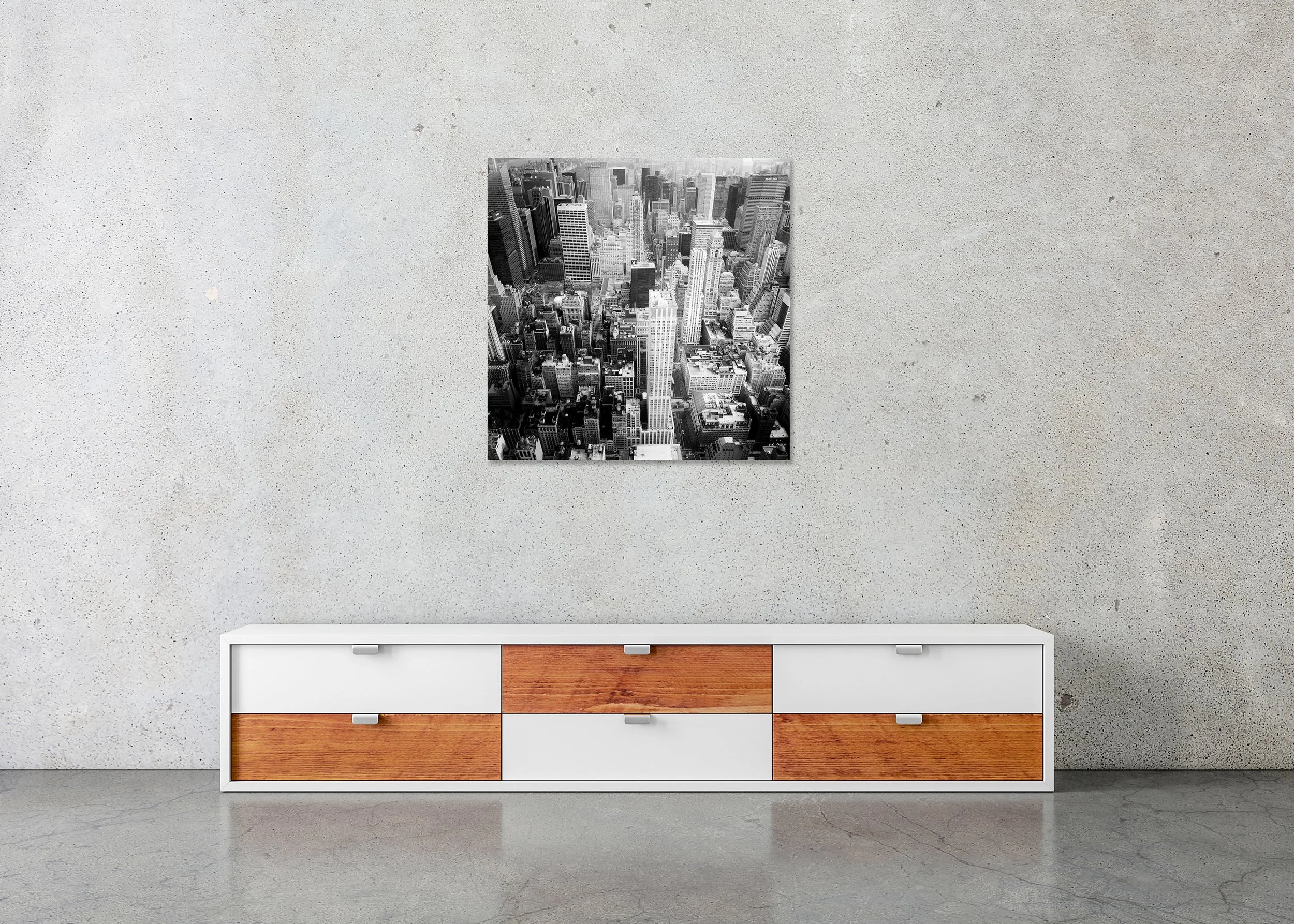 Black-and-white aerial photo of the NYC skyline with modern high-rise architecture and dense streets, photo print mounted to Dibond, frameless.