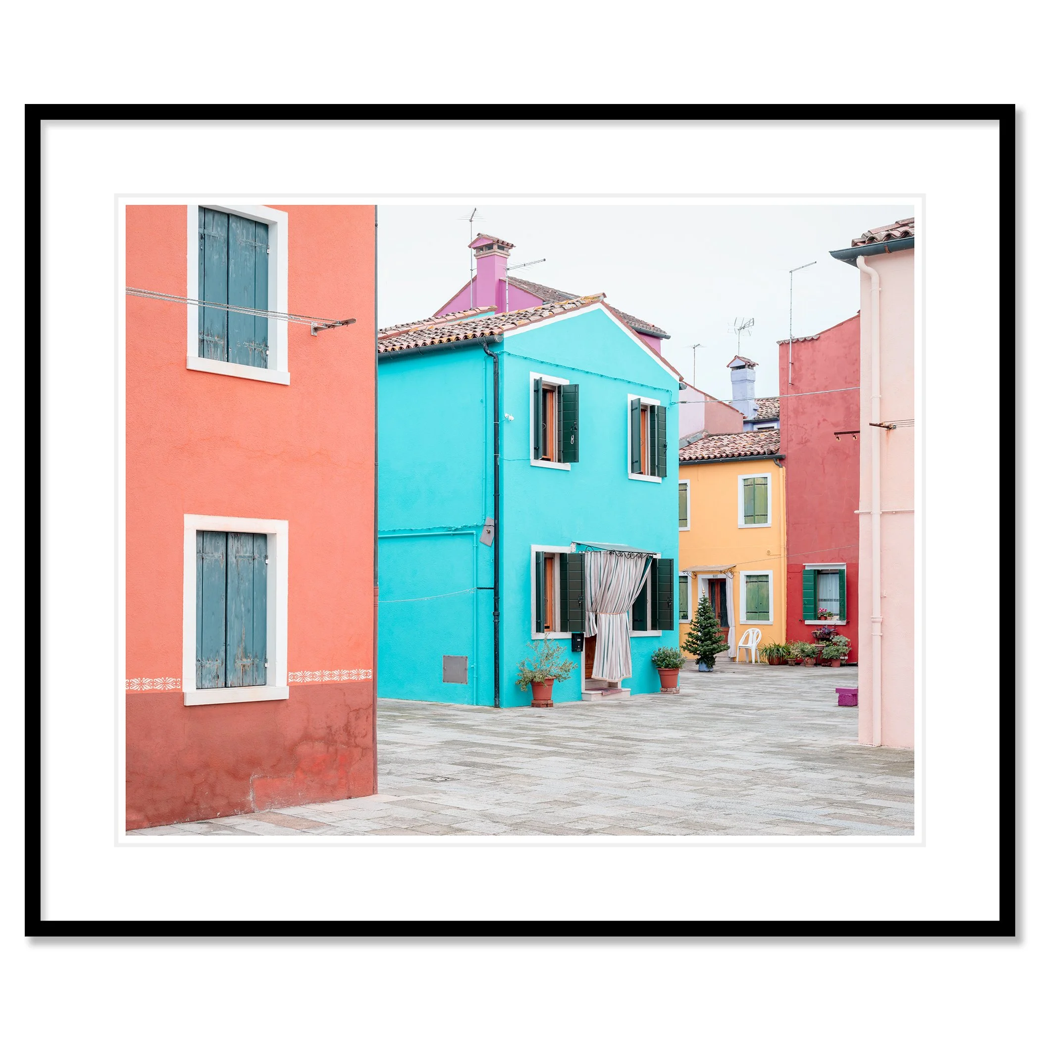 © 2025 Gerald Berghammer - Color cityscape photography. Colorful buildings with pastel pink, blue, yellow, and red walls, windows, and open shutters in a courtyard. Classic framed black