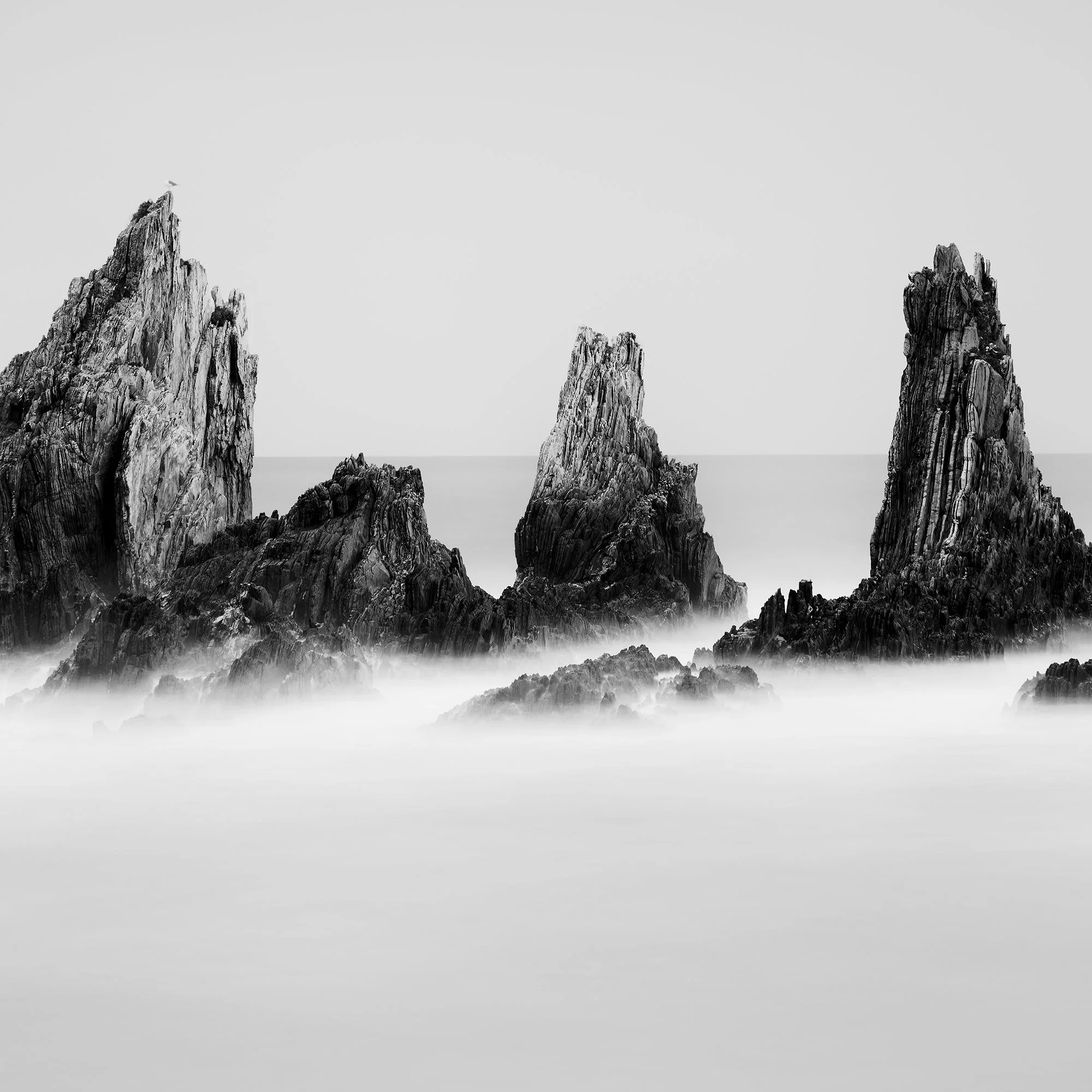 Rocky Peaks Study 1 by Gerald Berghammer, close detail of sculptural sea stacks in a minimalist black-and-white Atlantic seascape, Spain.