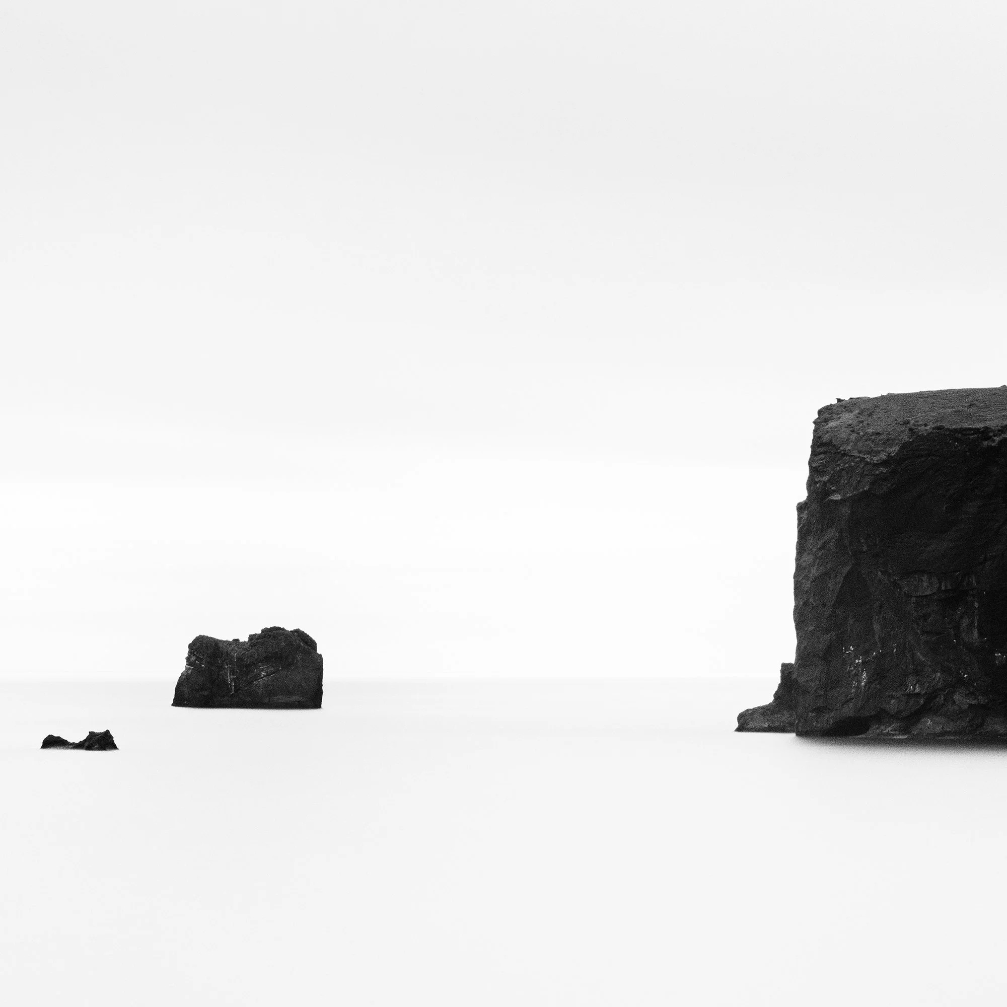 Detail of Black Rocks Study 2 – black-and-white long-exposure seascape of Iceland’s volcanic coast by Gerald Berghammer.
