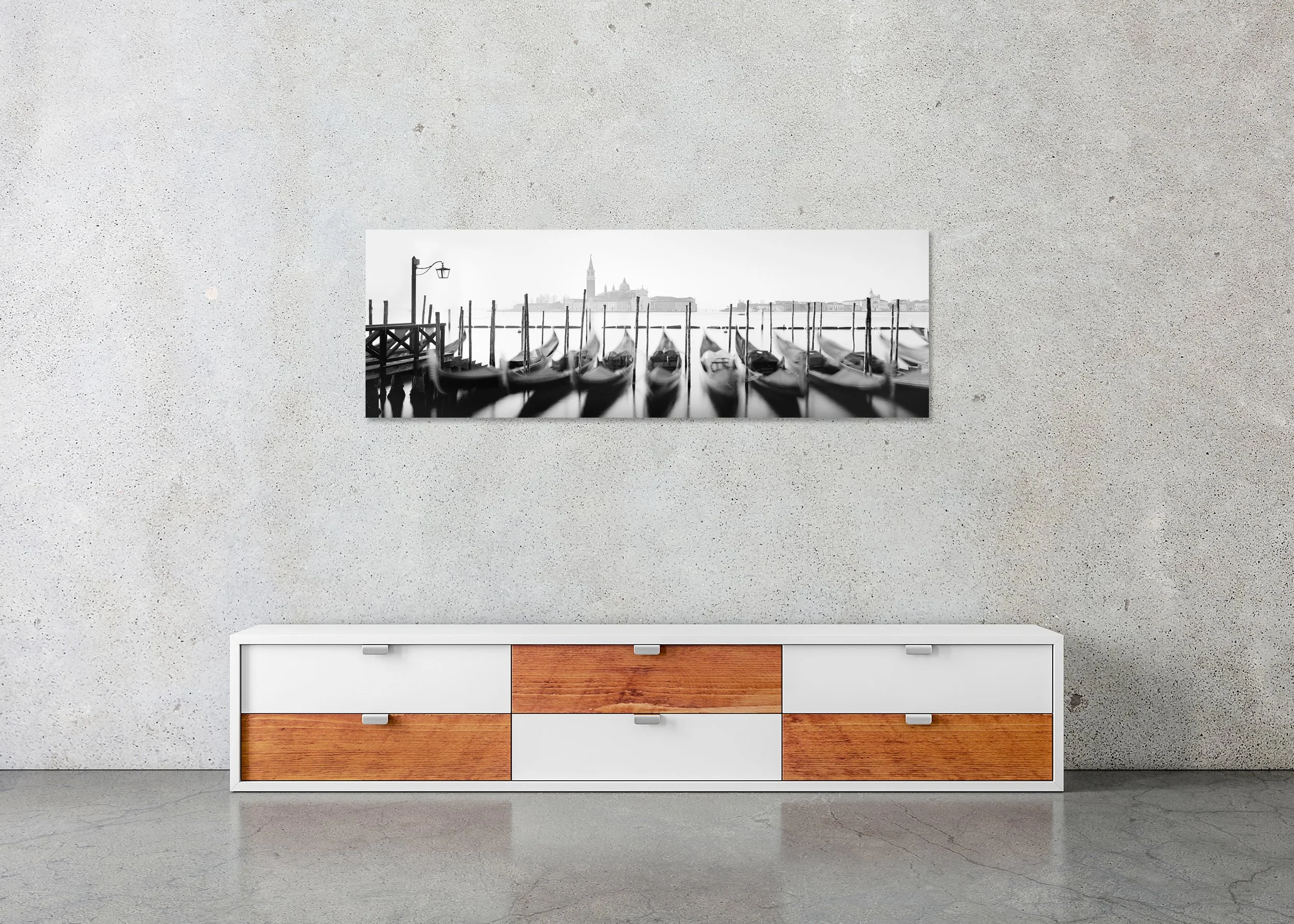 Twelve Gondolas by Gerald Berghammer, frameless black-and-white panoramic photograph on aluminium Dibond displayed above a sideboard in a minimalist interior.
