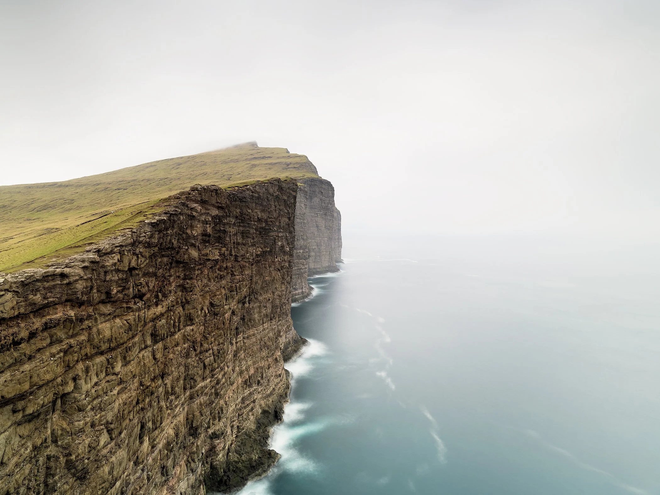 Dramatic cliffs of Trælanípa, known as Slave Cliff, Faroe Islands, colour seascape photograph by Gerald Berghammer