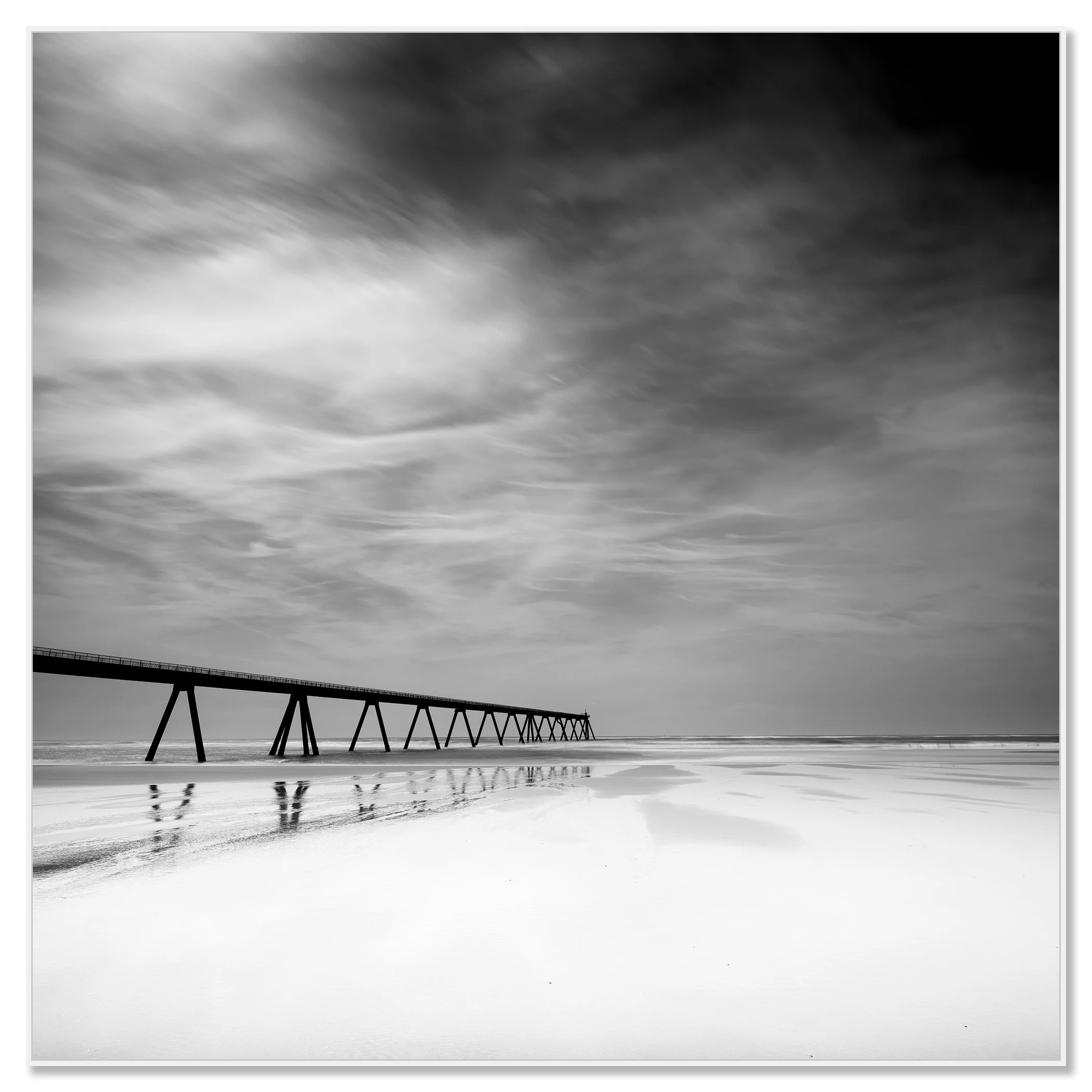 Framed black-and-white seascape photograph of Wharf de la Salie, France, in a white aluminium ArtBox frame
