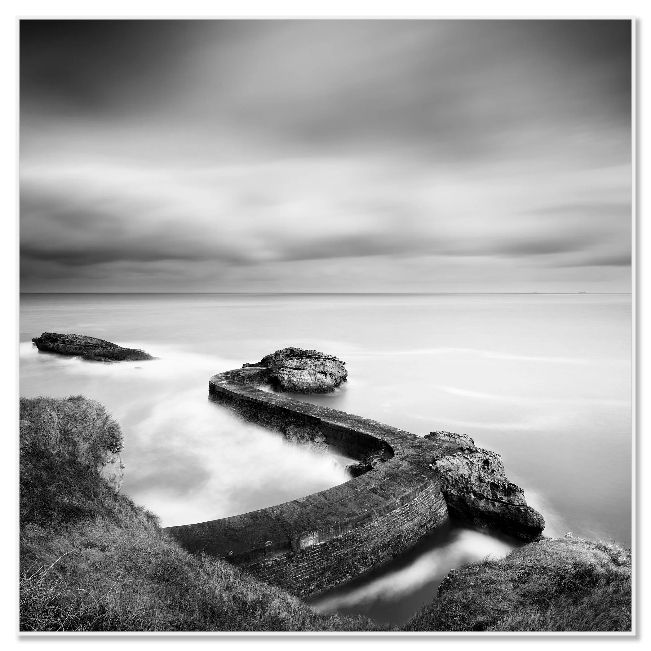 Breakwater Pier Study 1 by Gerald Berghammer, black-and-white Dibond fine art print in a white aluminium ArtBox frame.