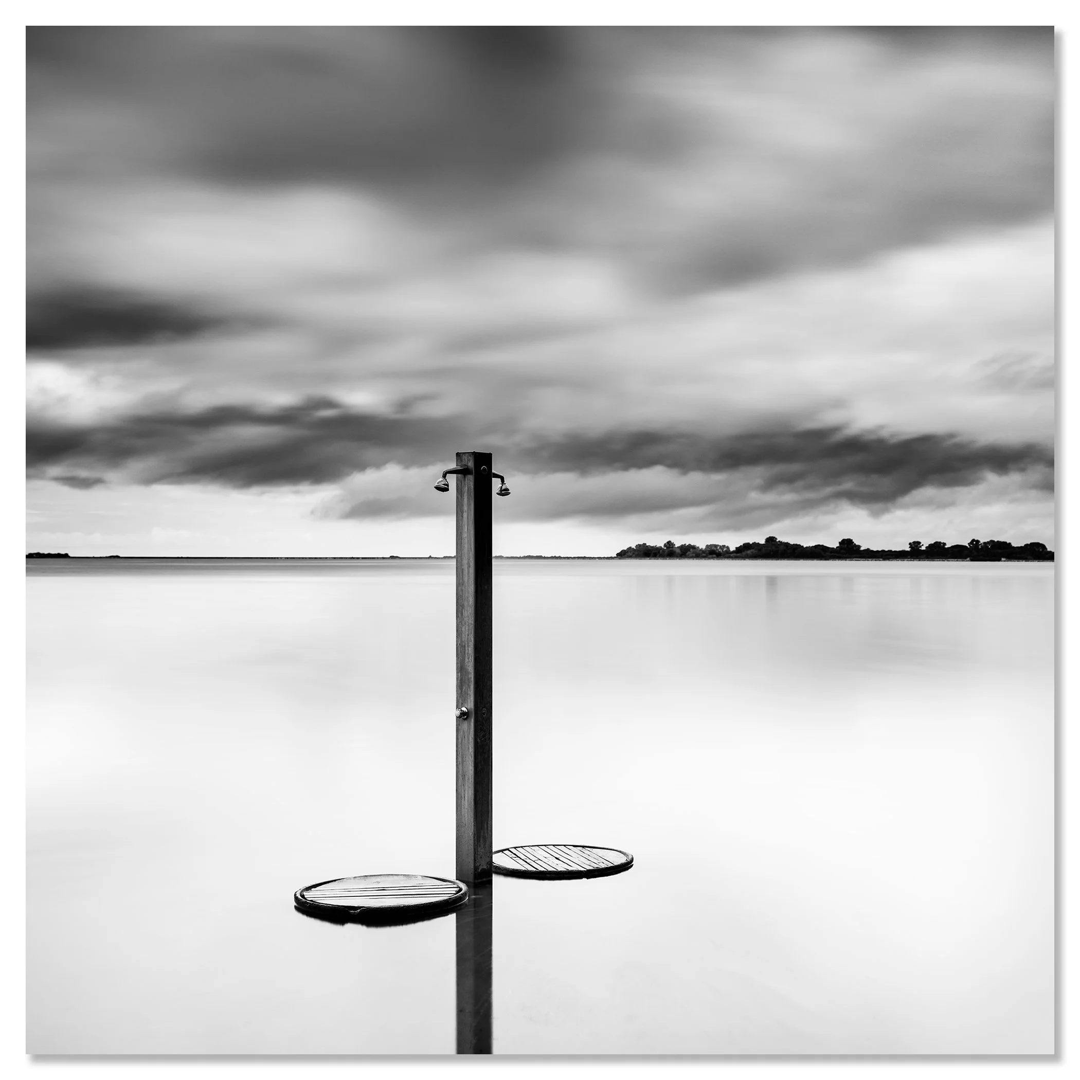 Beach Shower in a Storm – black-and-white seascape photograph mounted on aluminium Dibond and presented frameless by Gerald Berghammer.