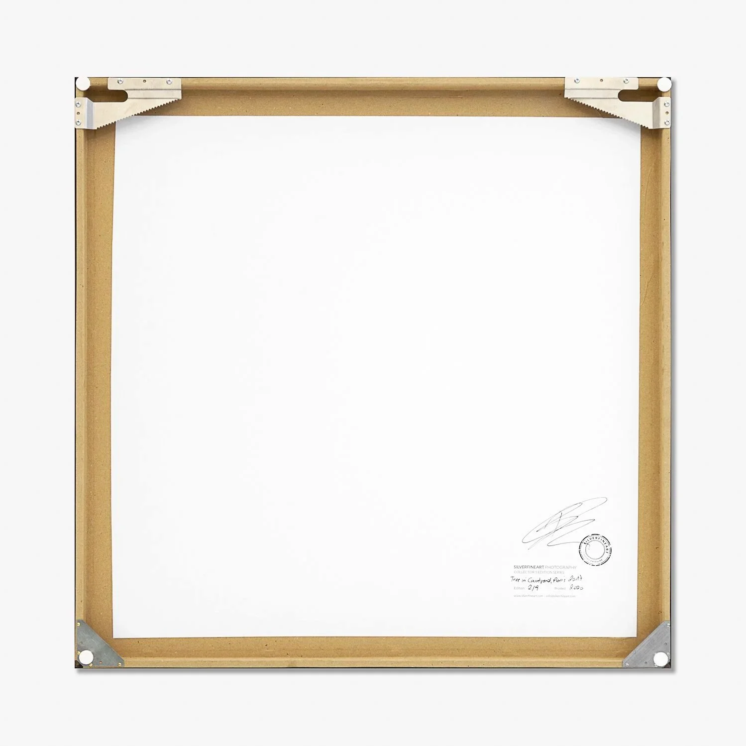 Gerald Berghammer – Tree in the Courtyard, reverse of the framed artwork showing wooden backing, artist's signature and metal corner fittings.