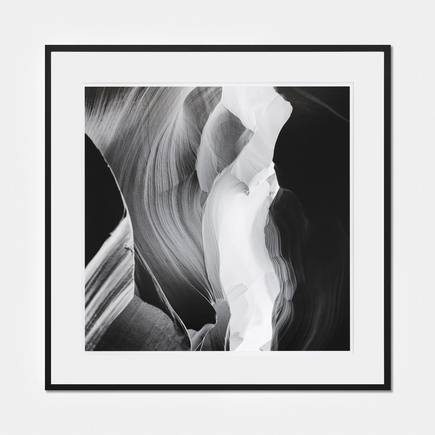 Gerald Berghammer – Antelope Canyon 6, framed black-and-white fine art photograph with a black wooden frame and archival mount.
