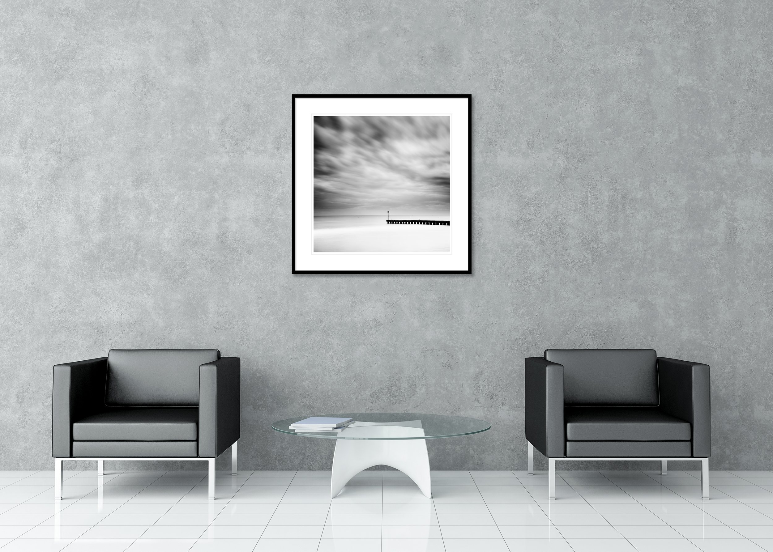 Wooden Pier in the Sea Study 1 displayed in a modern interior as an archival pigment print in a black aluminium frame with a white mount by Gerald Berghammer.