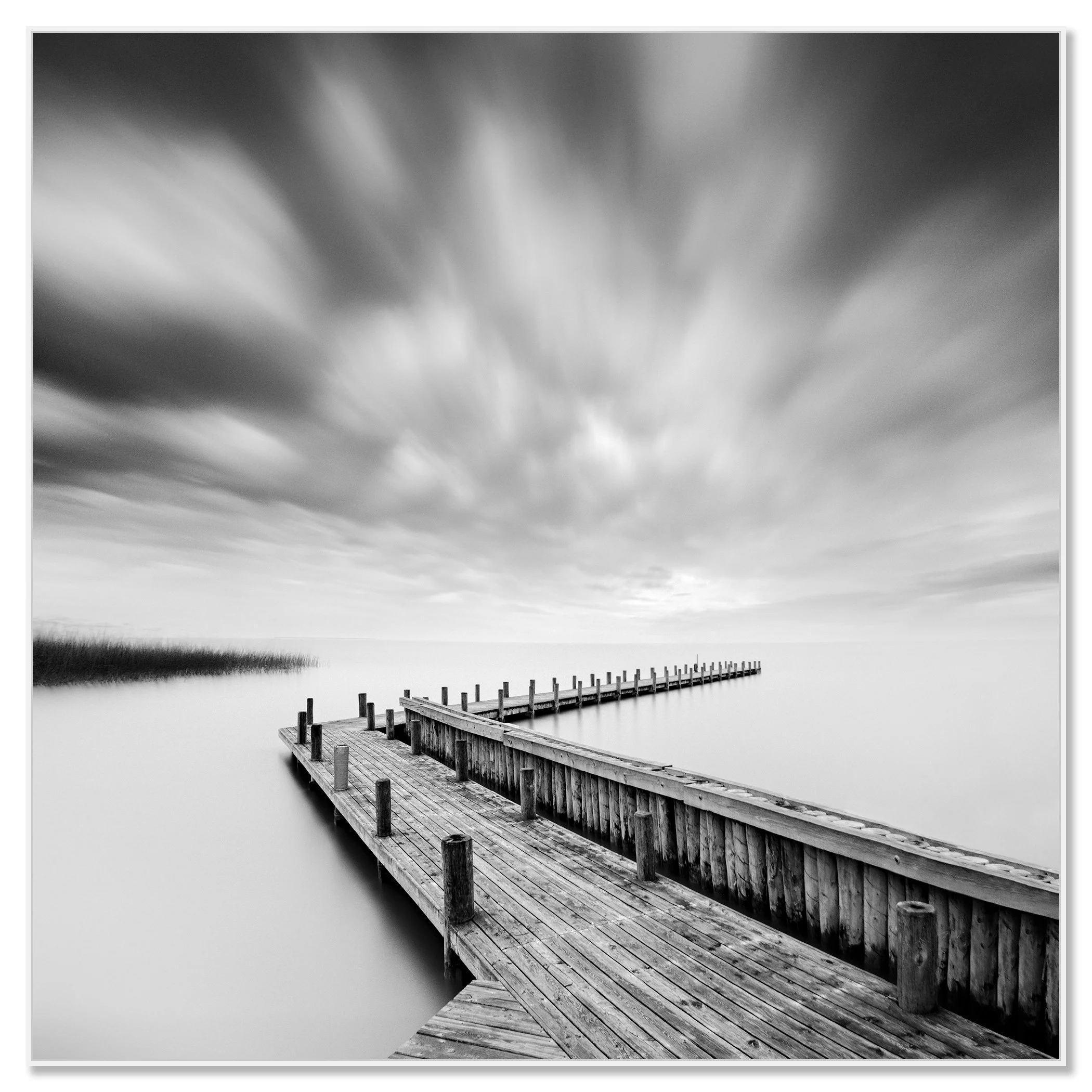 Wood Pier Study 1 by Gerald Berghammer, black-and-white photograph mounted on aluminium Dibond in a white ArtBox frame.