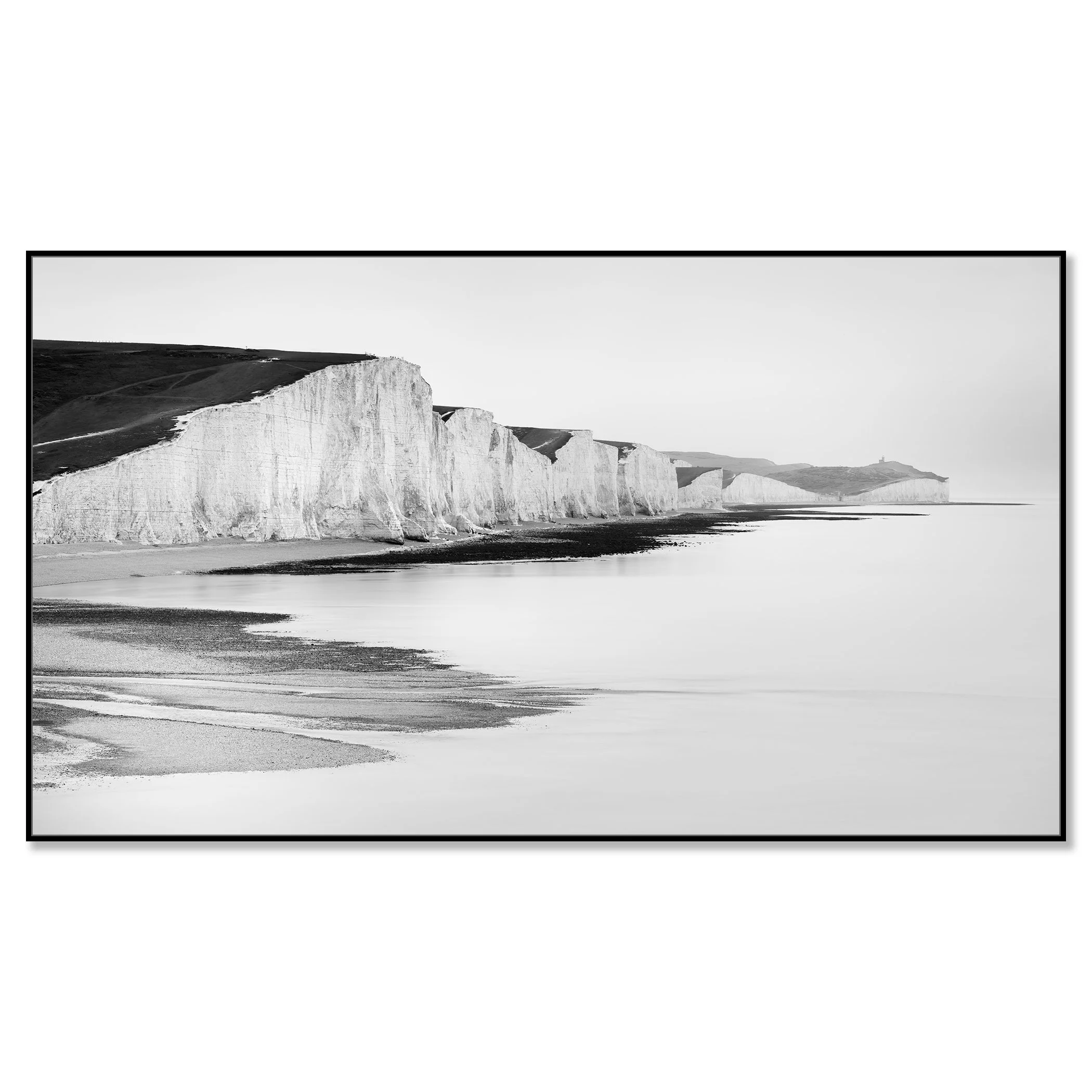 White chalk cliffs on the Sussex coast in England, viewed in black and white from the shoreline – framed ArtBox black