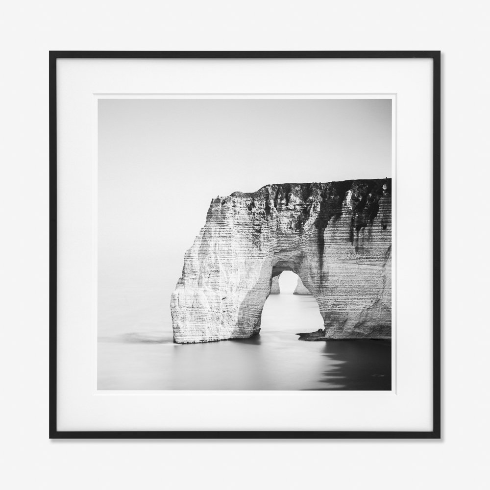 The Cliffs of Étretat Study 4 by Gerald Berghammer, framed black-and-white photograph of the chalk sea arch in Normandy, France.