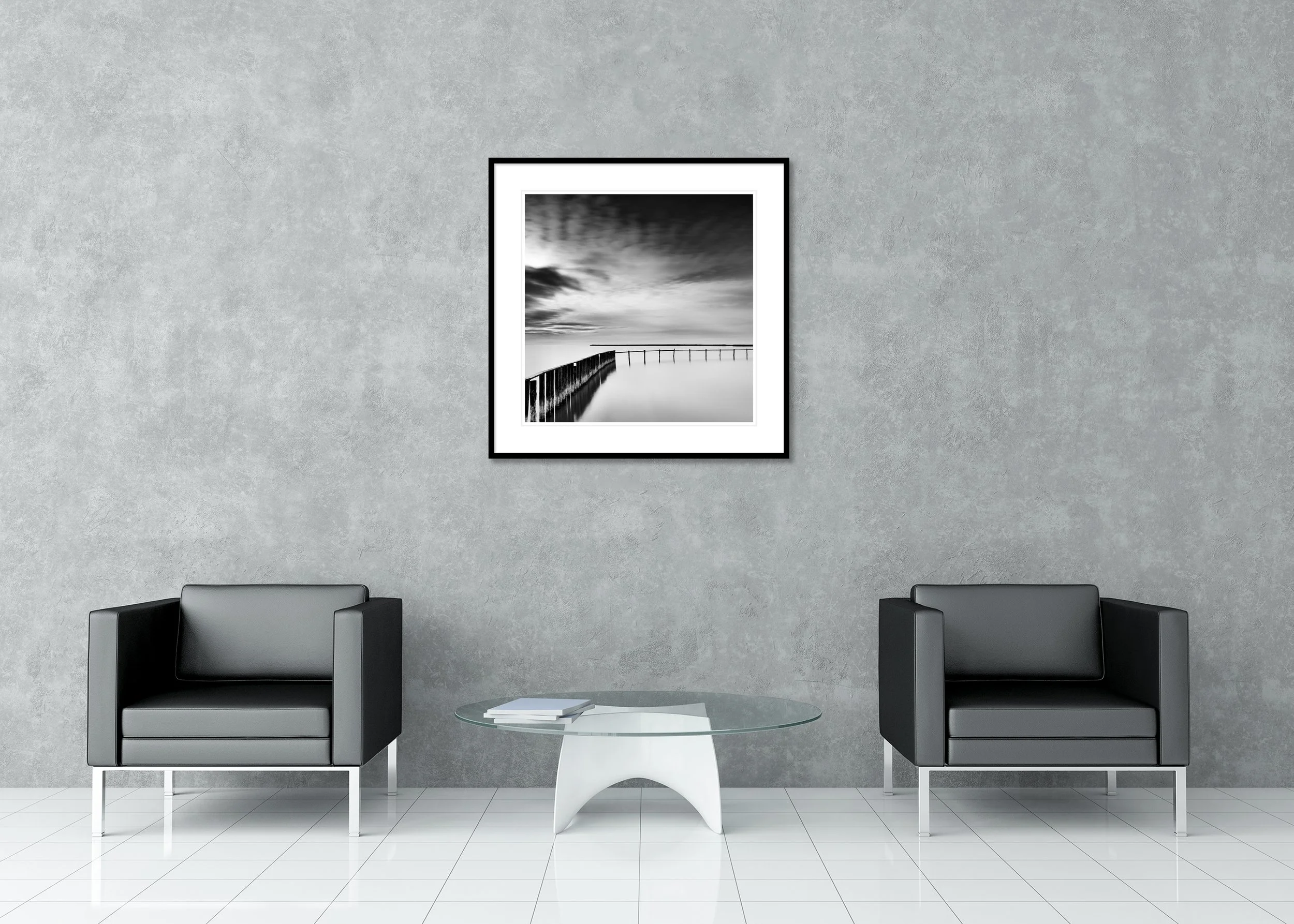 Long exposure black and white print of a lake, jetty and overcast sky, archival pigment print in a classic frame with mount