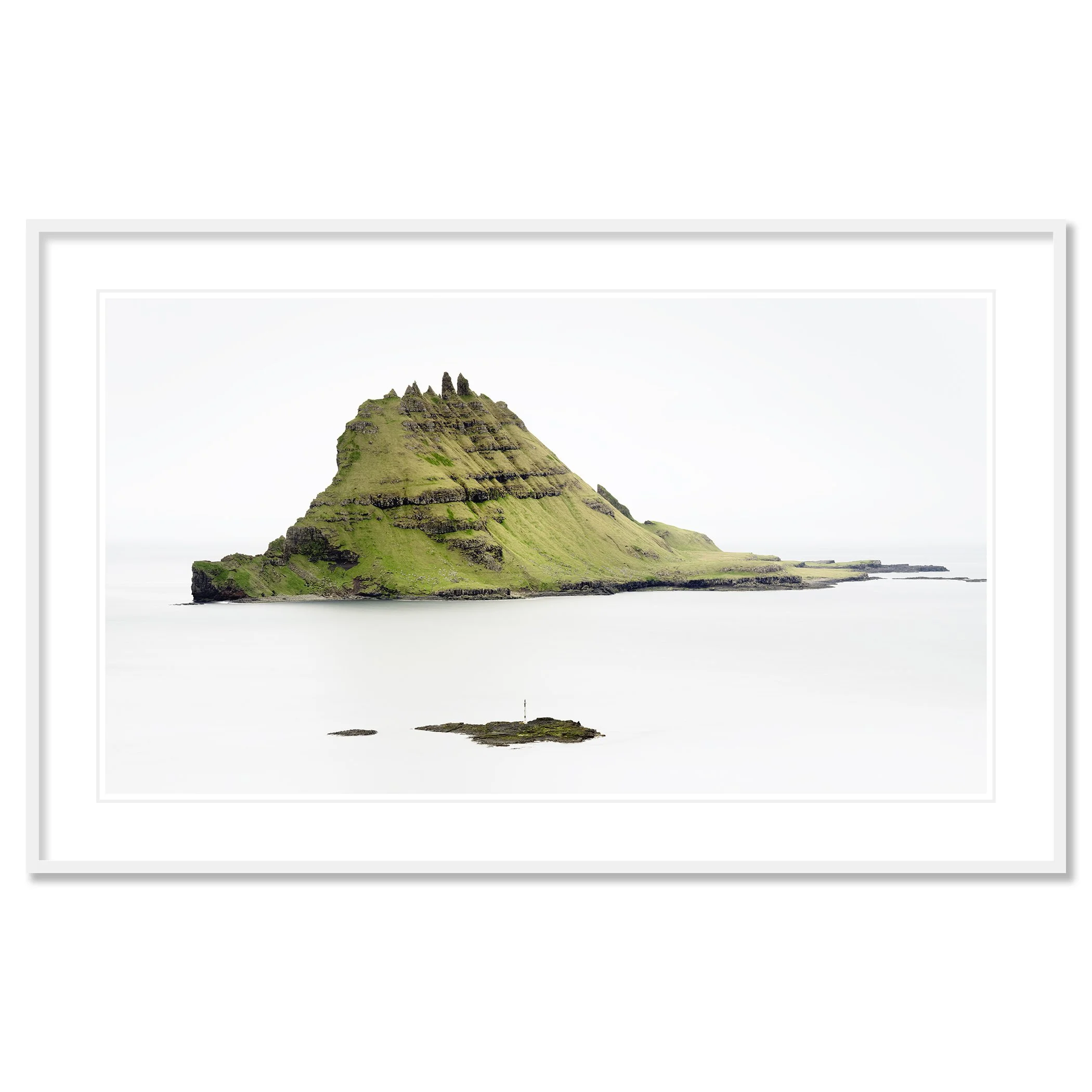 Green Rock Island – Faroe Islands, colour fine art print in a white aluminium frame with white mount