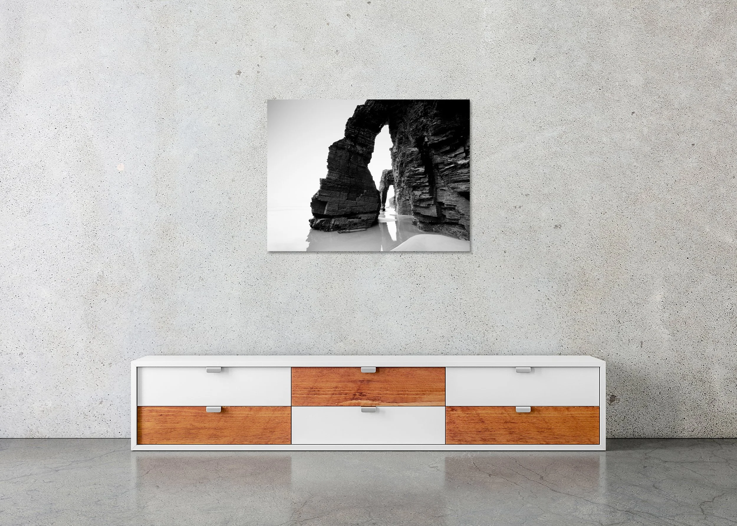 Fine art black and white seascape of rock arch formations on the beach mirrored in reflective tidal water, ChromaLuxe metal print frameless