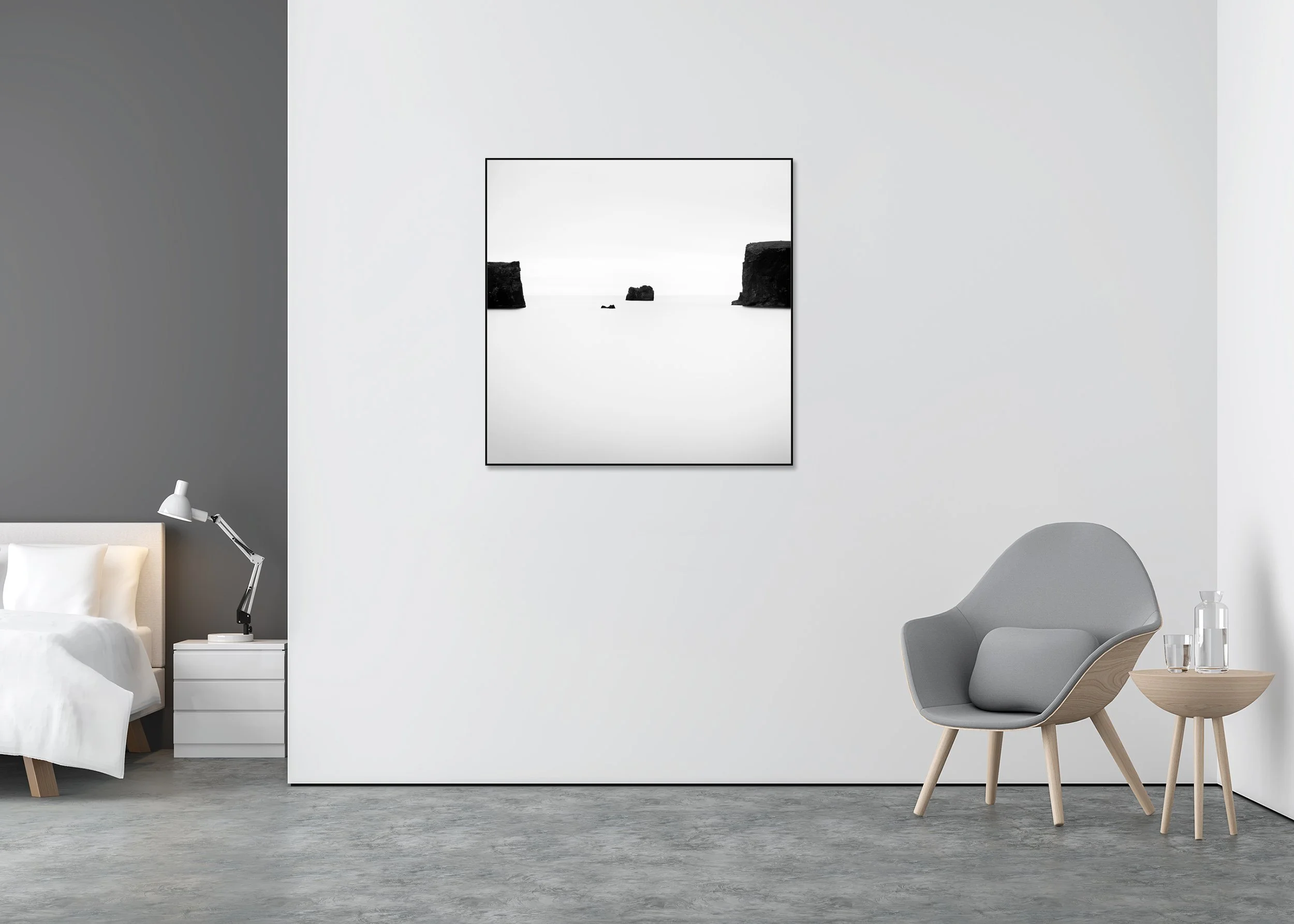 Minimalist black and white photograph of calm ocean water with three dark rock formations and distant sea cliffs, printed on ChromaLuxe aluminium metal.