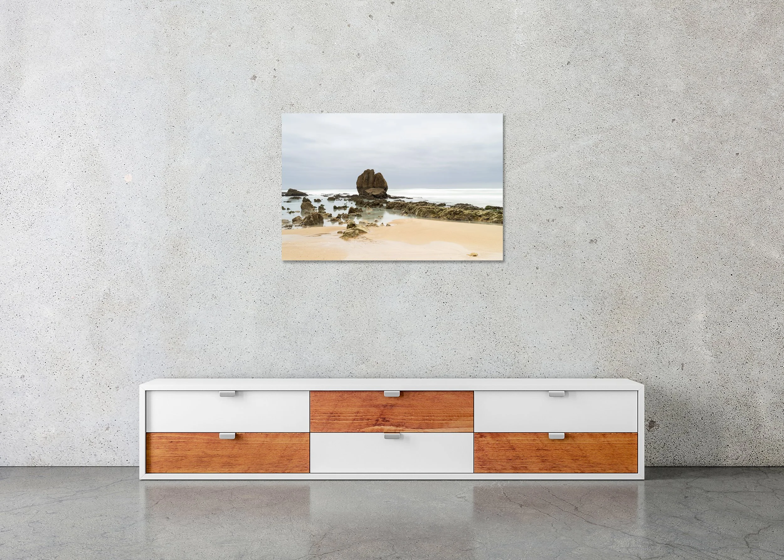 Rocks on the Shore, Study 3 – France, frameless colour photograph on aluminium Dibond displayed above a low cabinet.